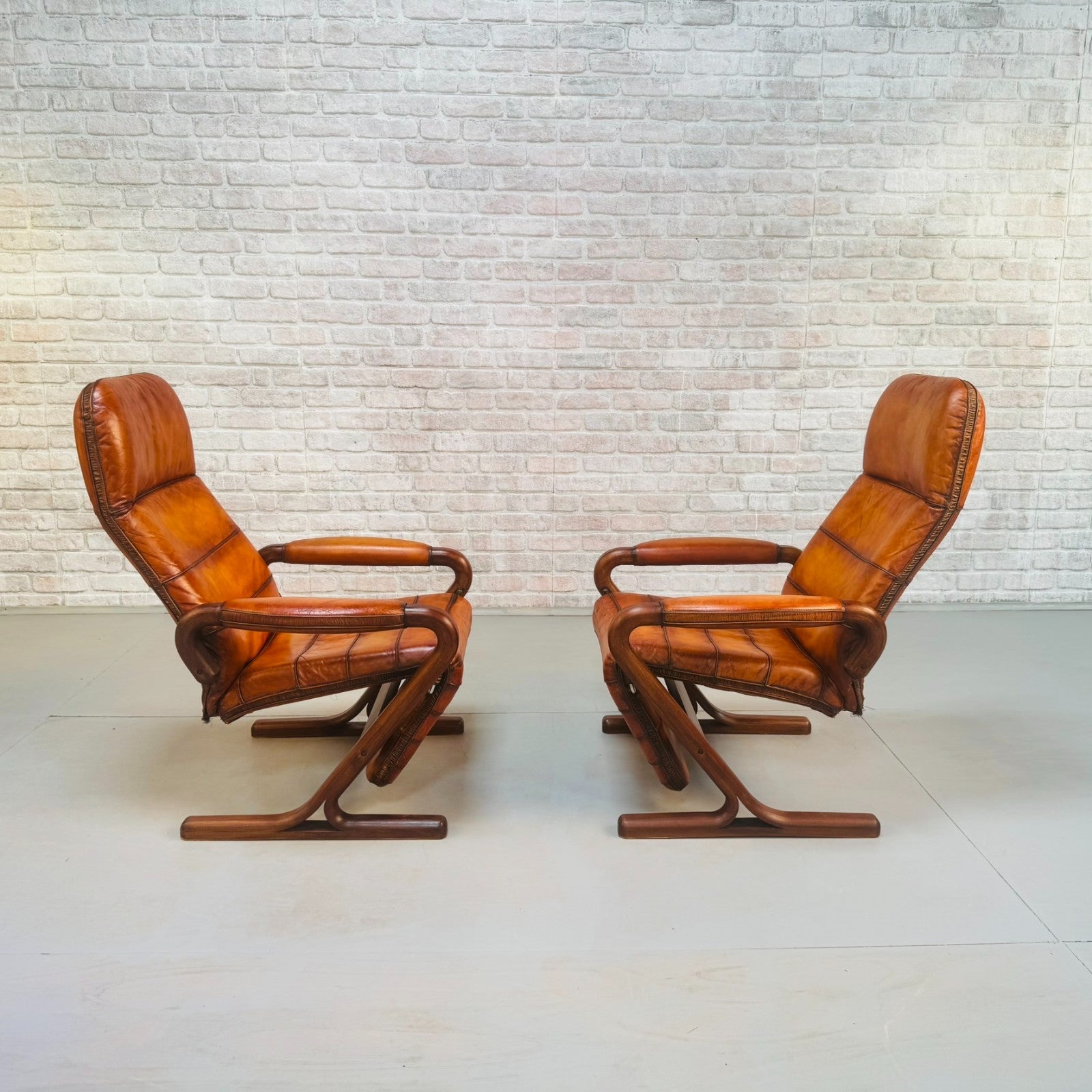 Pair of Vintage Danish Zero Gravity Reclining Tan Leather Armchairs Teak Frame