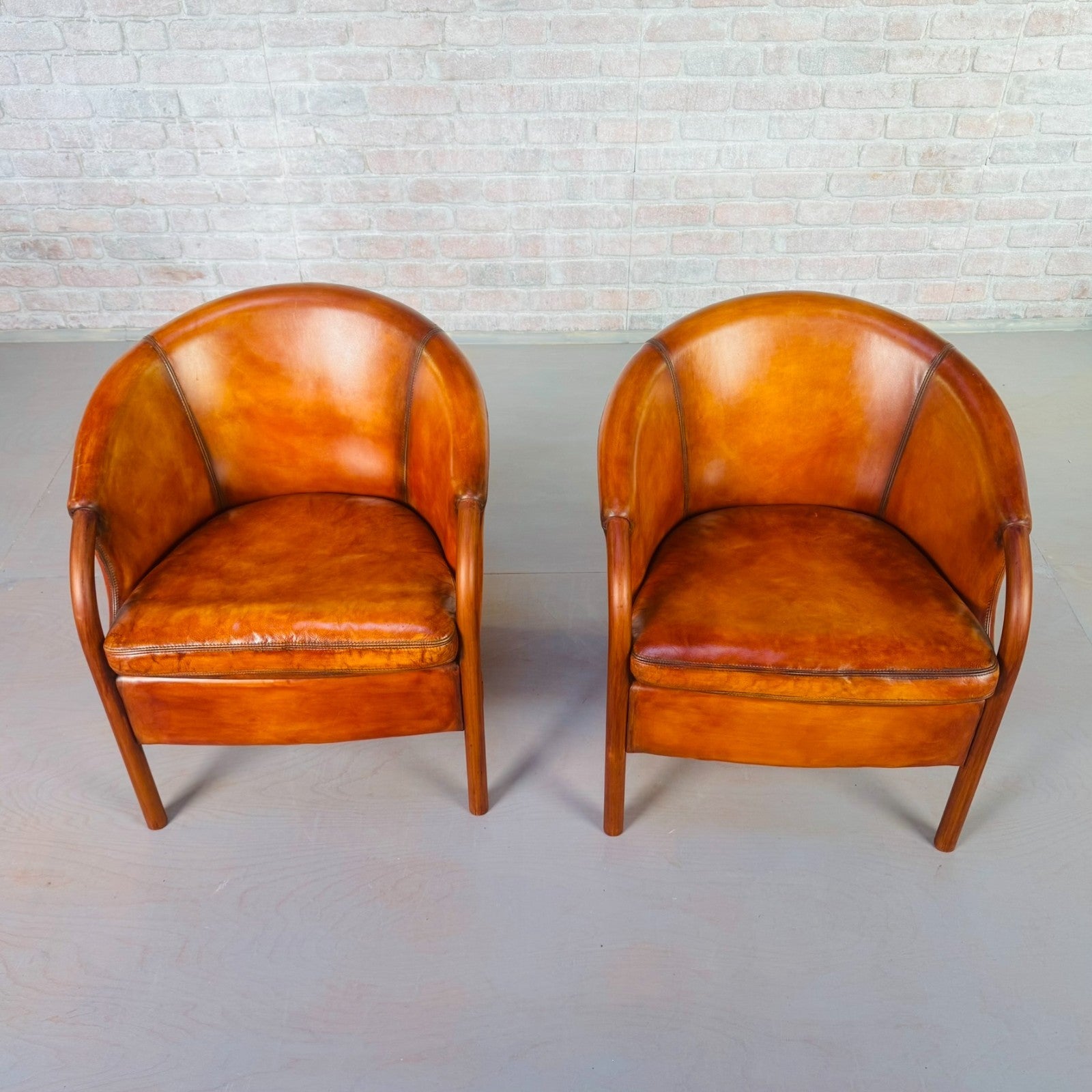 Pair of Vintage Danish Tan Leather Tub Chairs by Stouby