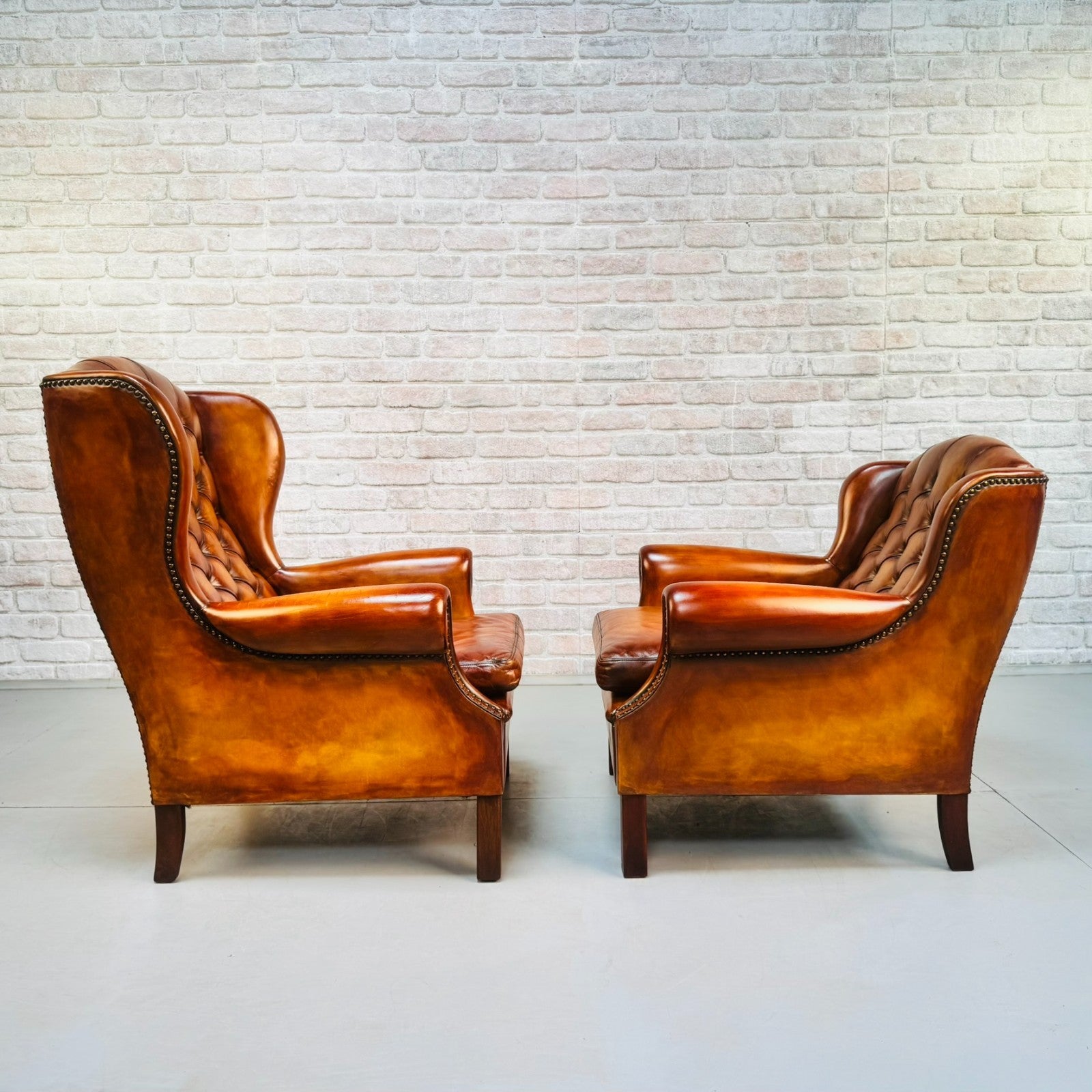 Vintage Pair of Danish Tan Leather Wingback Chairs