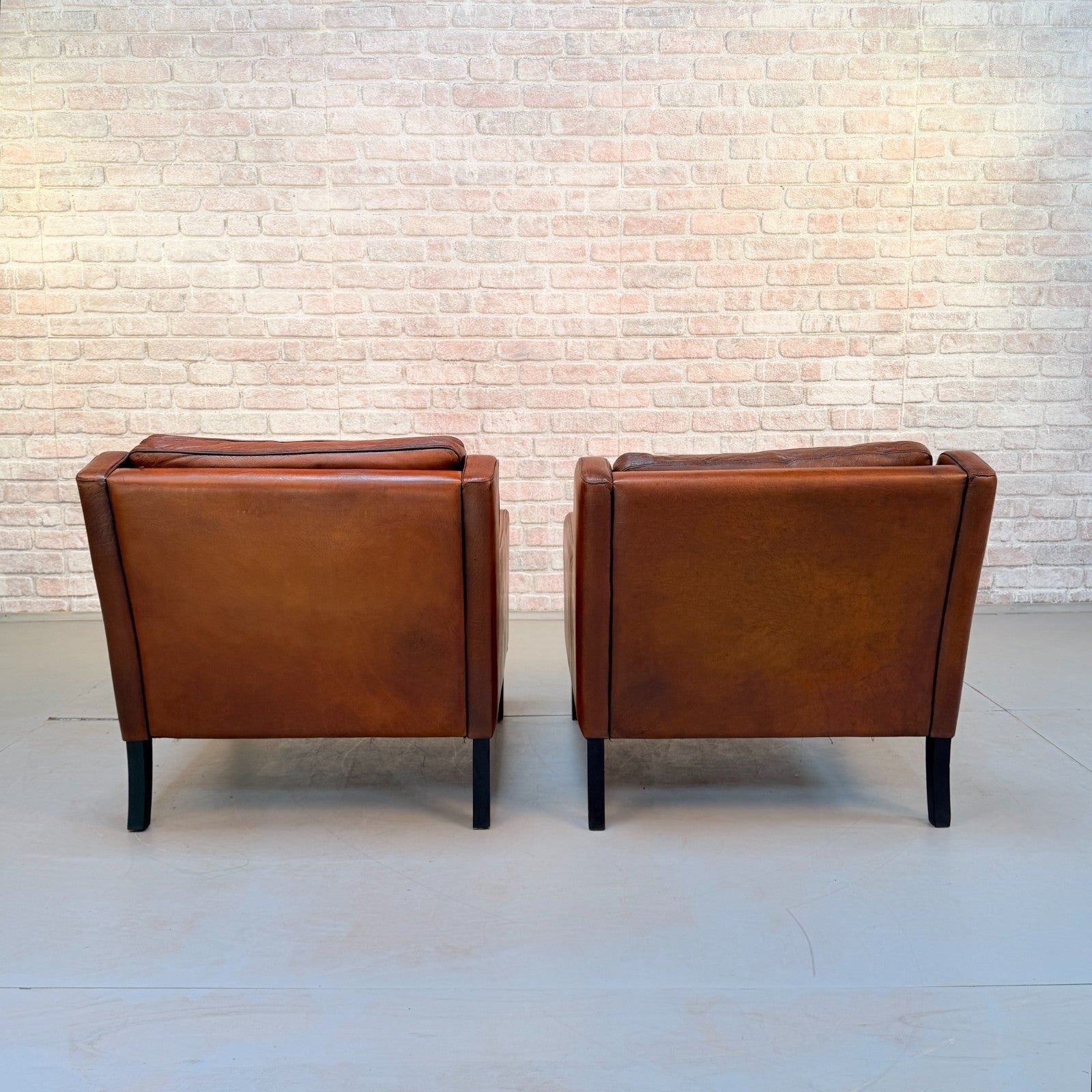 Vintage Near Pair Danish Tan Leather Armchairs Hand Dyed Feather Cushions