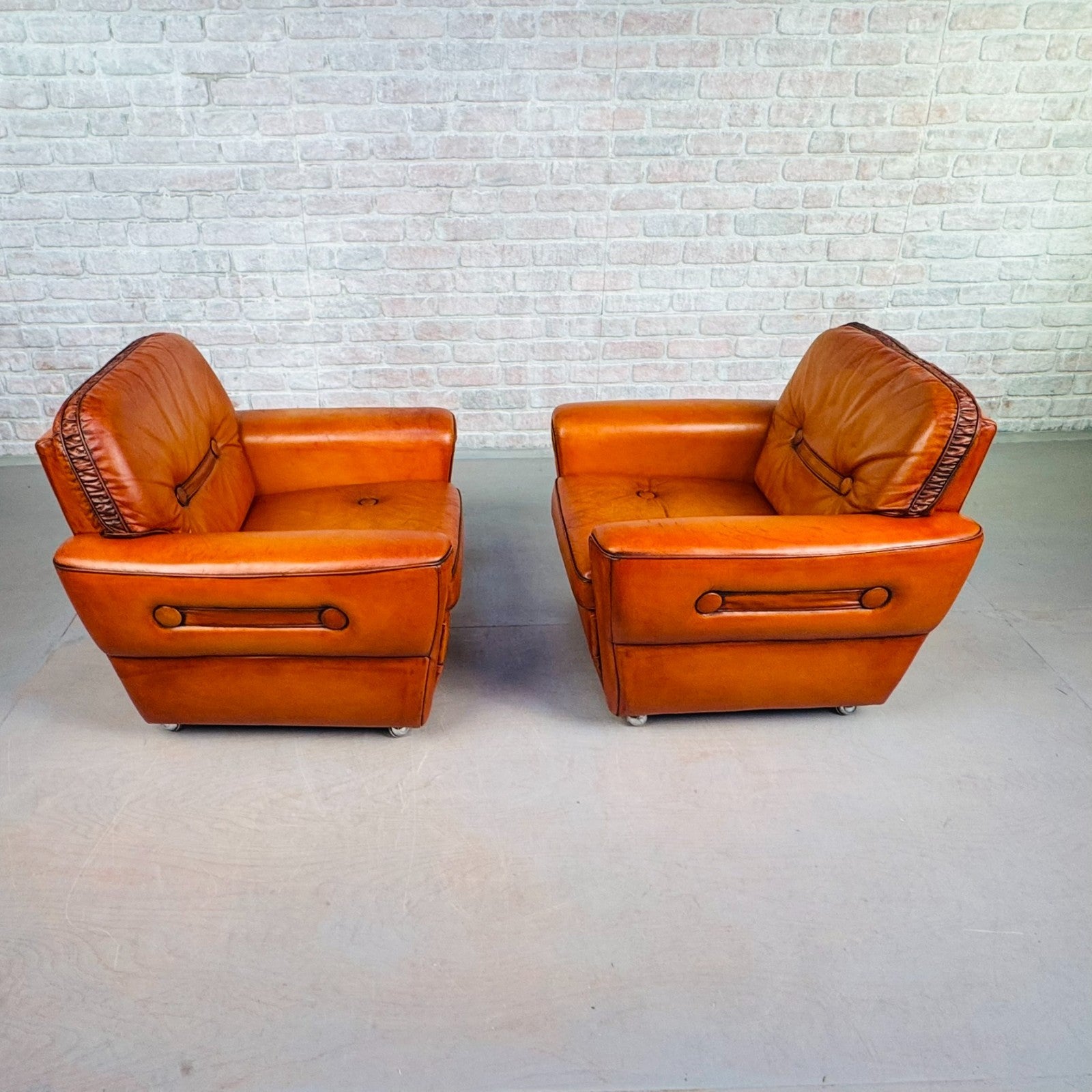 Pair of Elegant Danish Tan Leather Lounge Chairs