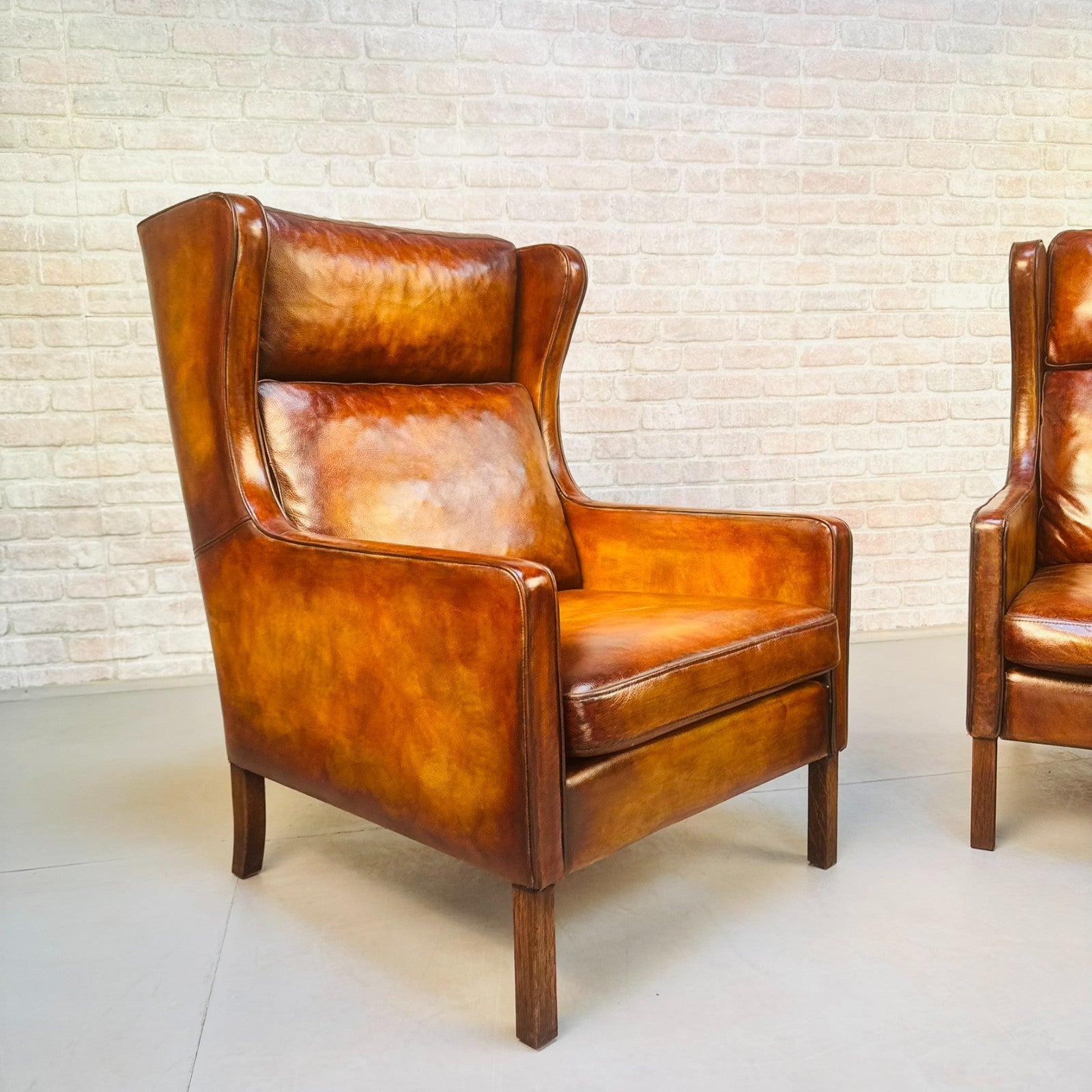 Pair Vintage Danish Wingback Chairs & Footstool Tan Leather Lounge Set