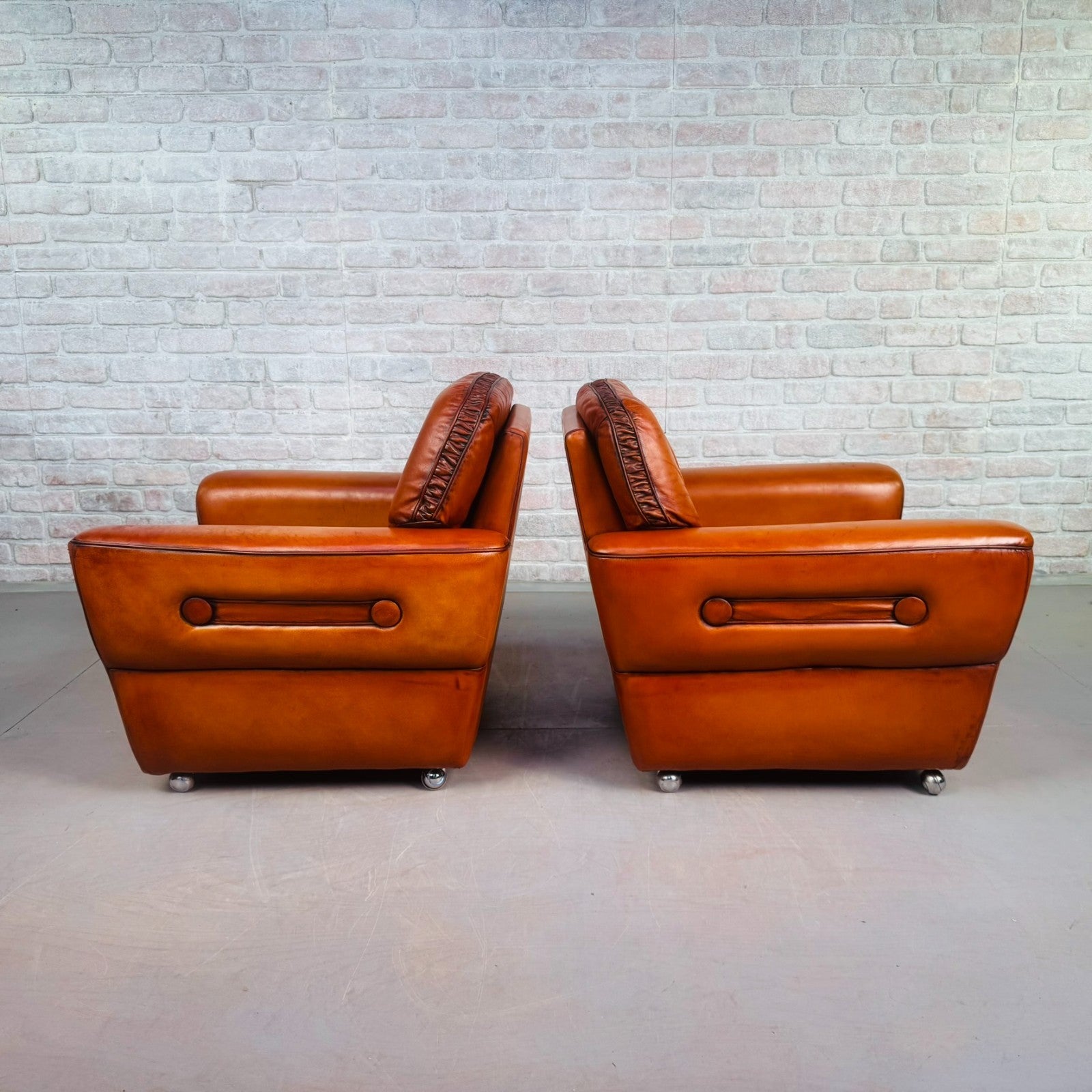 Pair of Elegant Danish Tan Leather Lounge Chairs
