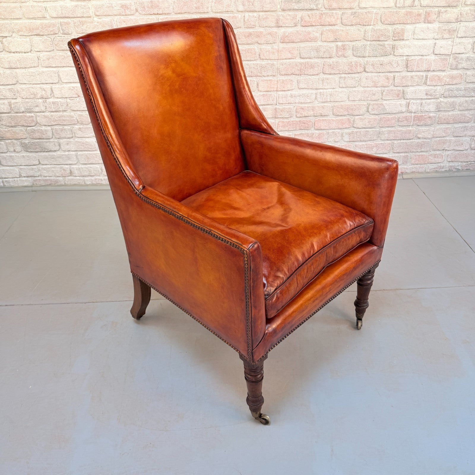 Circa 1910 Antique Tan Leather Armchair Hand Dyed Feather Cushions Castors