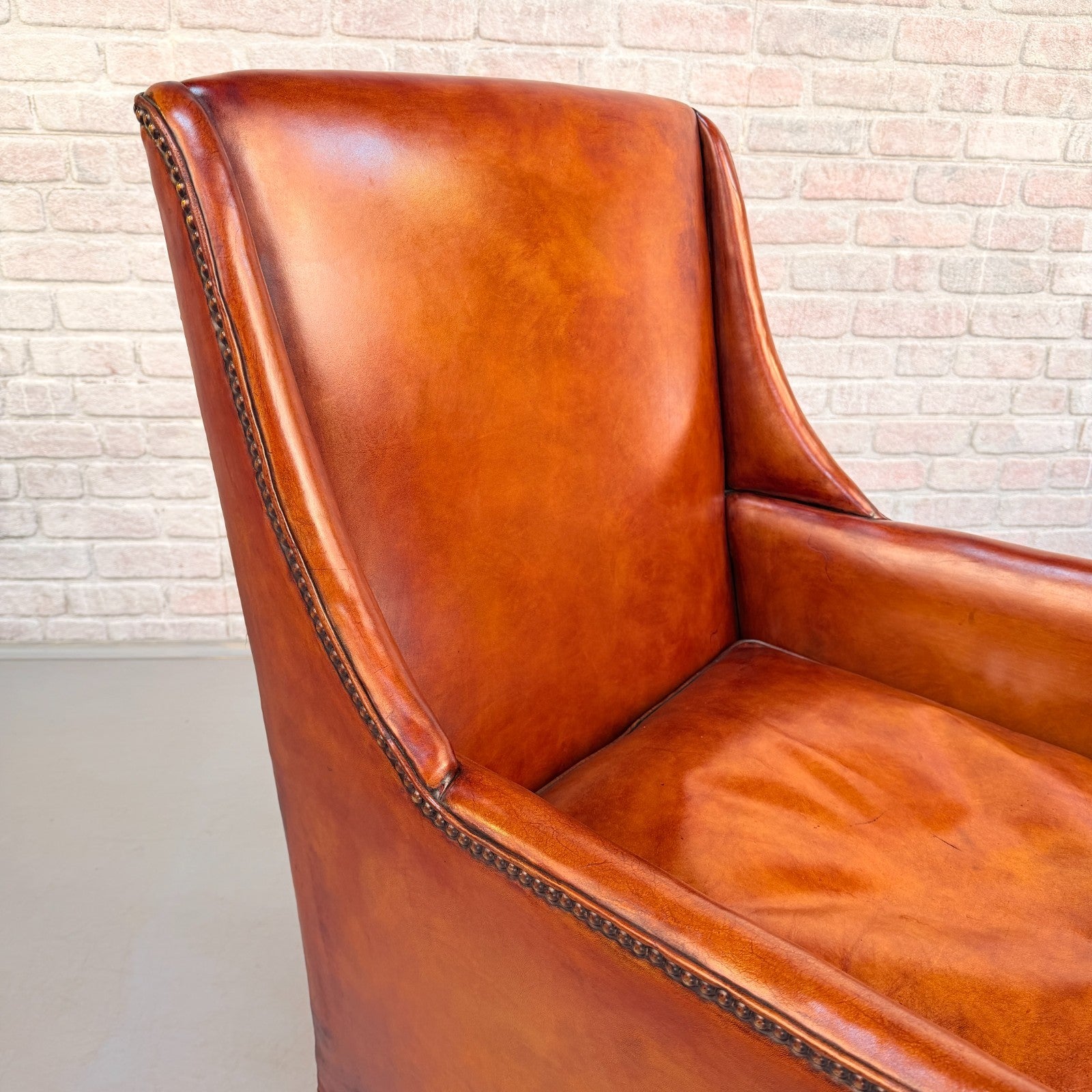 Circa 1910 Antique Tan Leather Armchair Hand Dyed Feather Cushions Castors