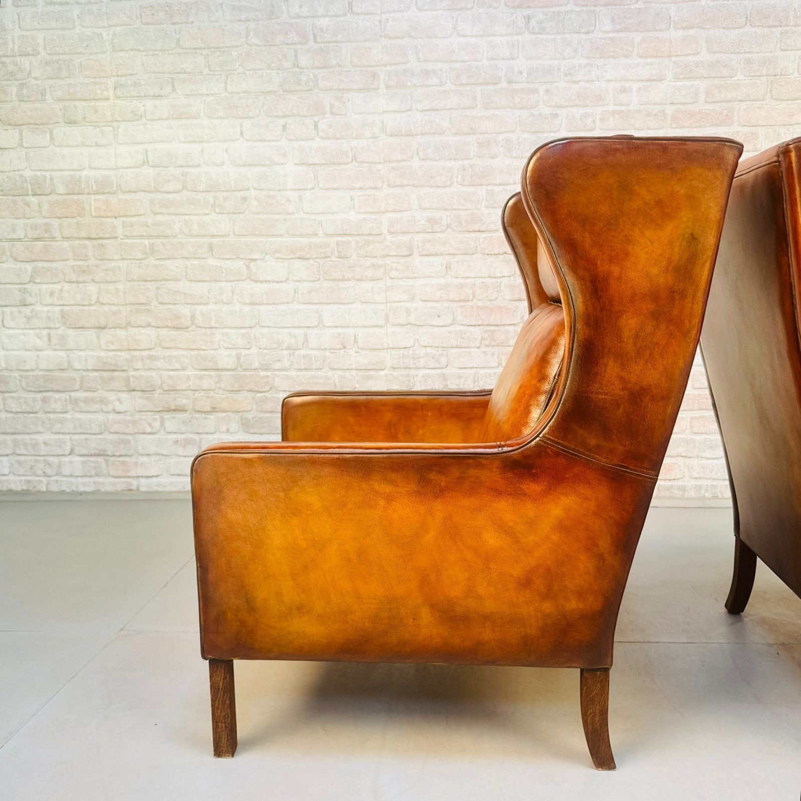 Pair Vintage Danish Wingback Chairs & Footstool Tan Leather Lounge Set