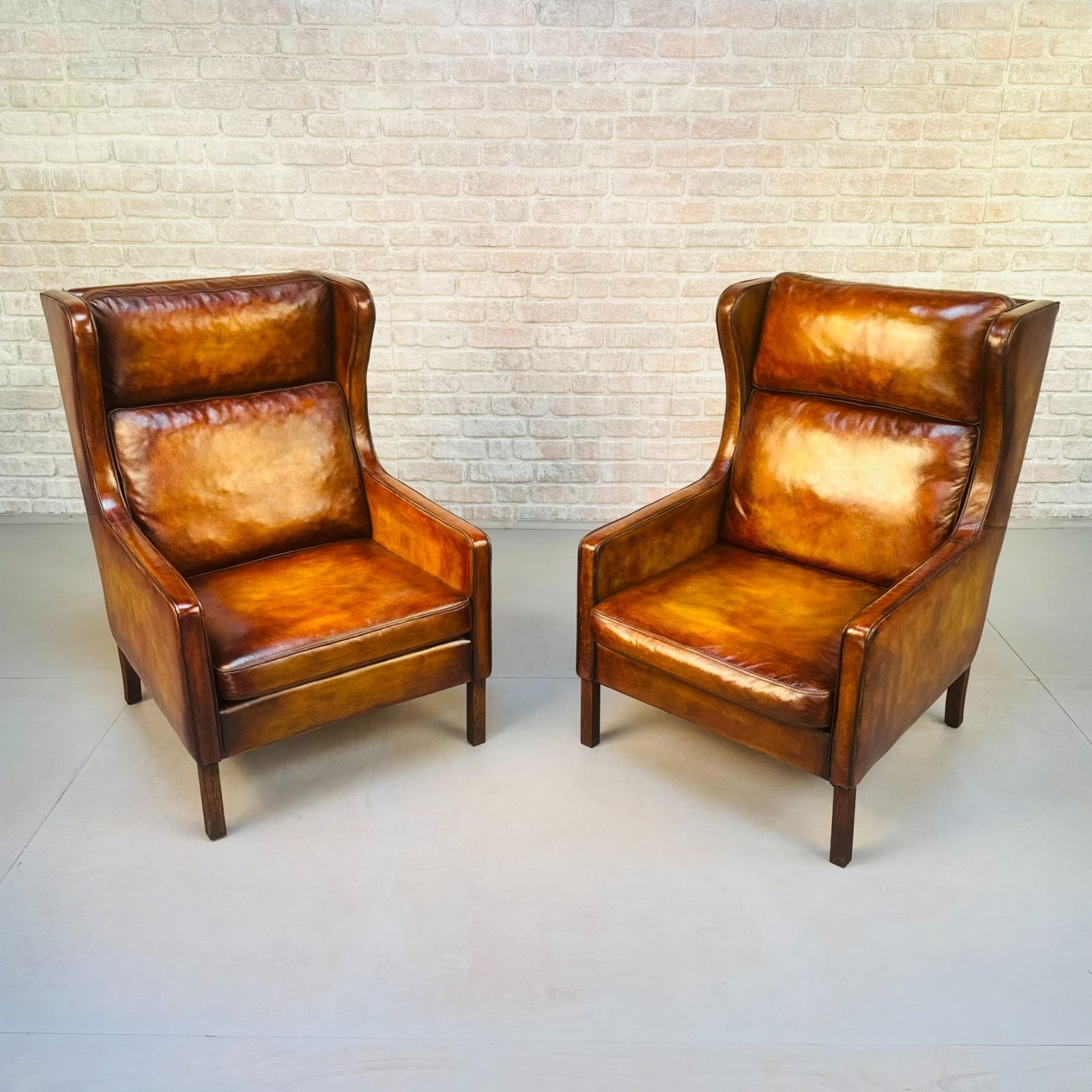 Pair Vintage Danish Wingback Chairs & Footstool Tan Leather Lounge Set