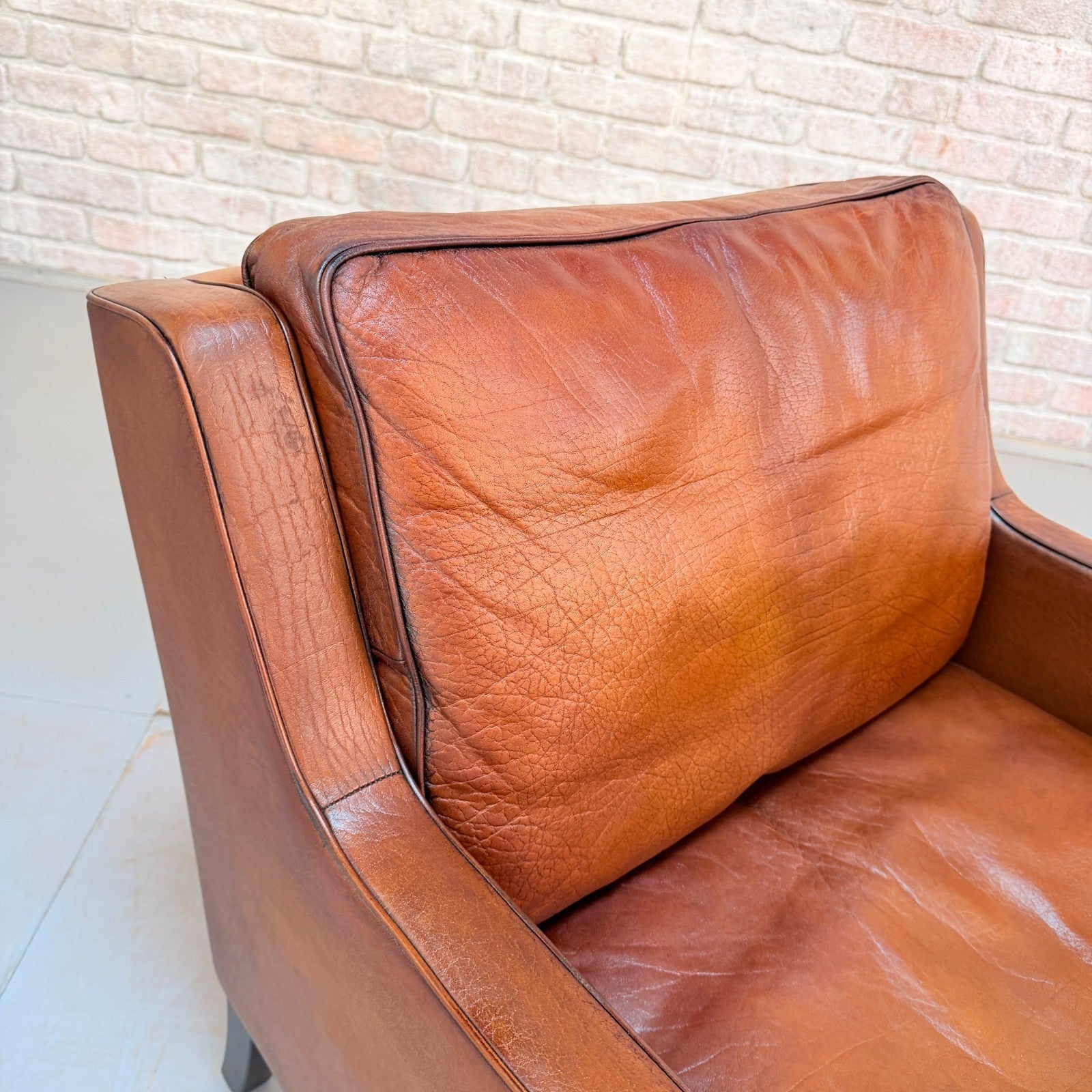 Vintage Near Pair Danish Tan Leather Armchairs Hand Dyed Feather Cushions
