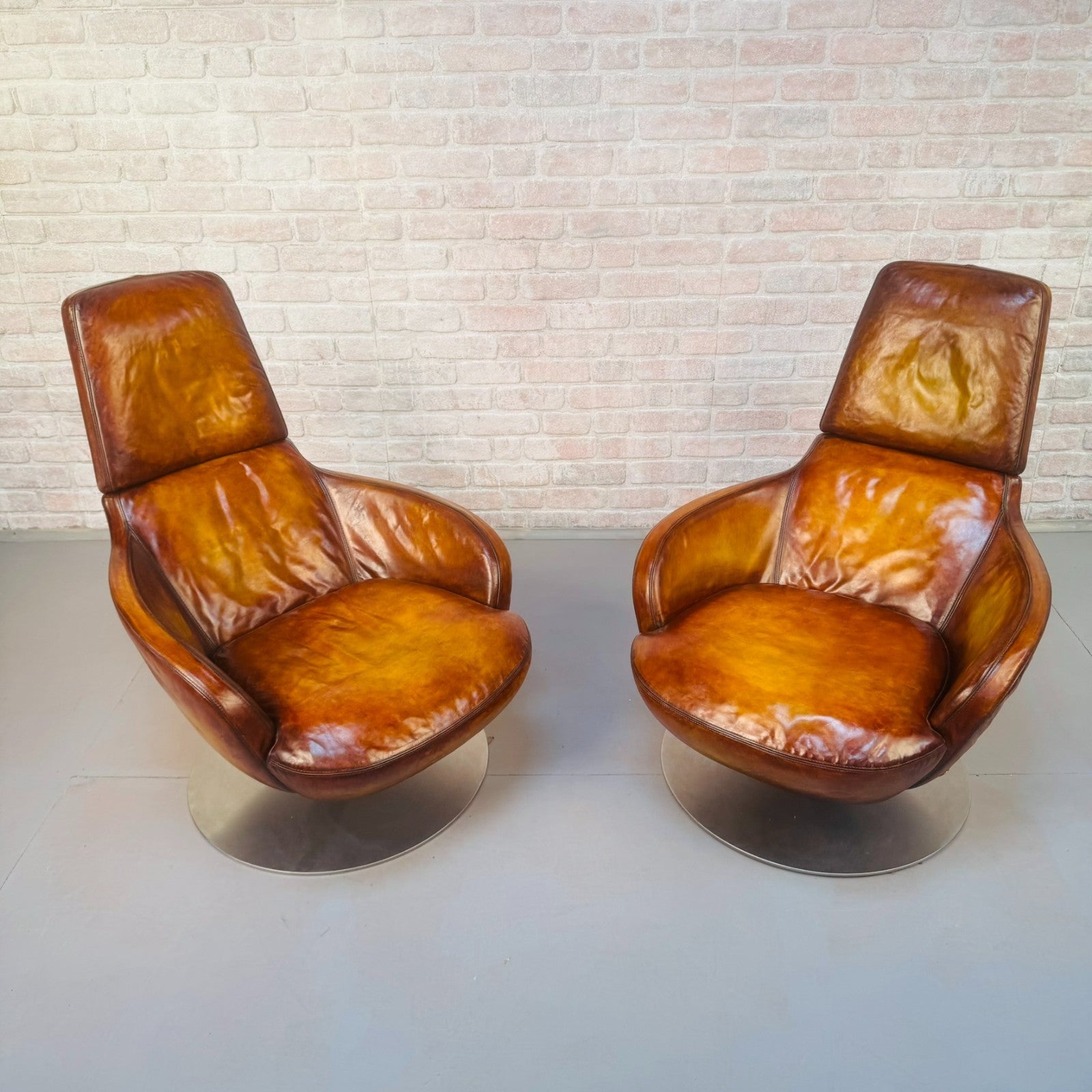 Pair of Vintage Italian Swivel Tan Leather Chairs