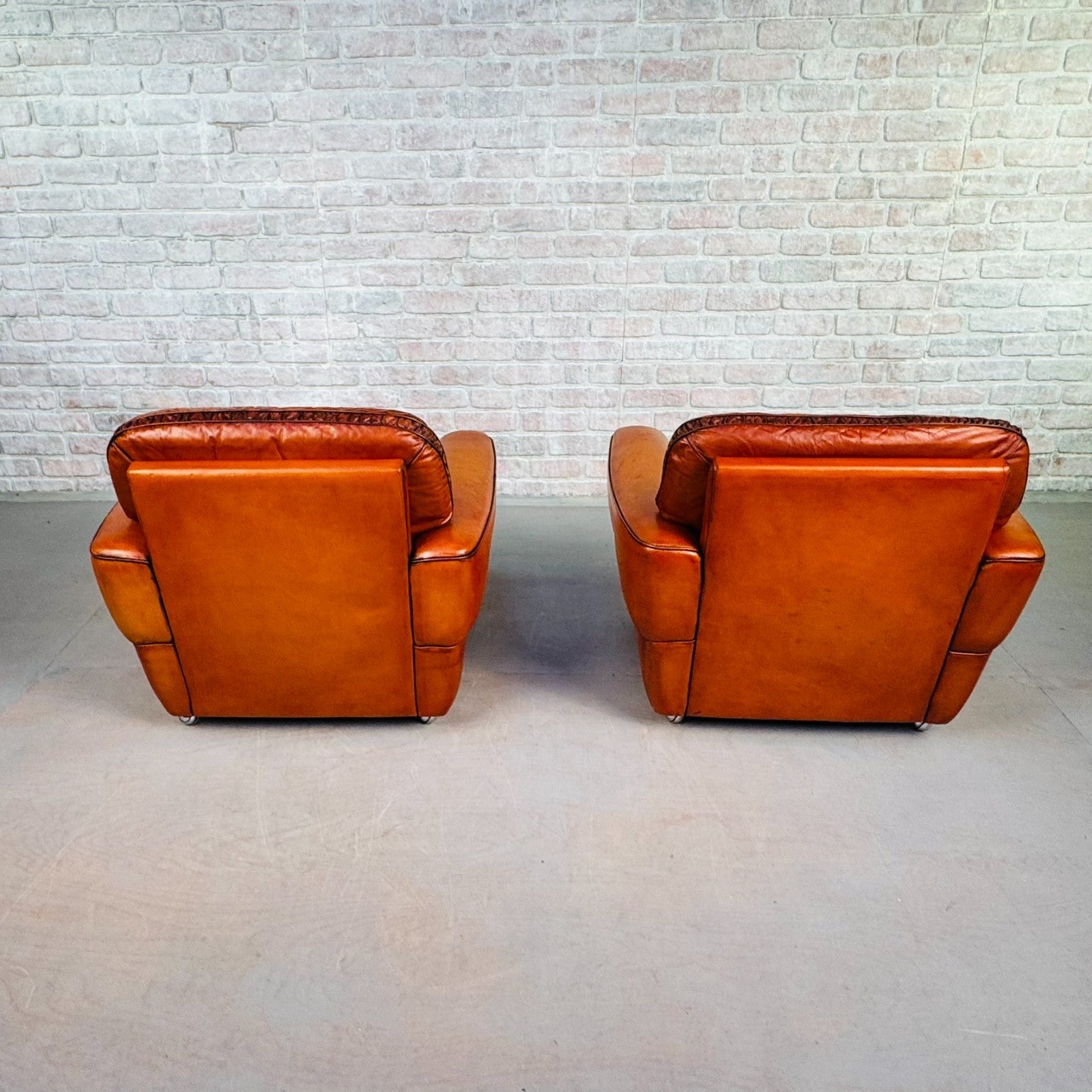 Pair of Elegant Danish Tan Leather Lounge Chairs