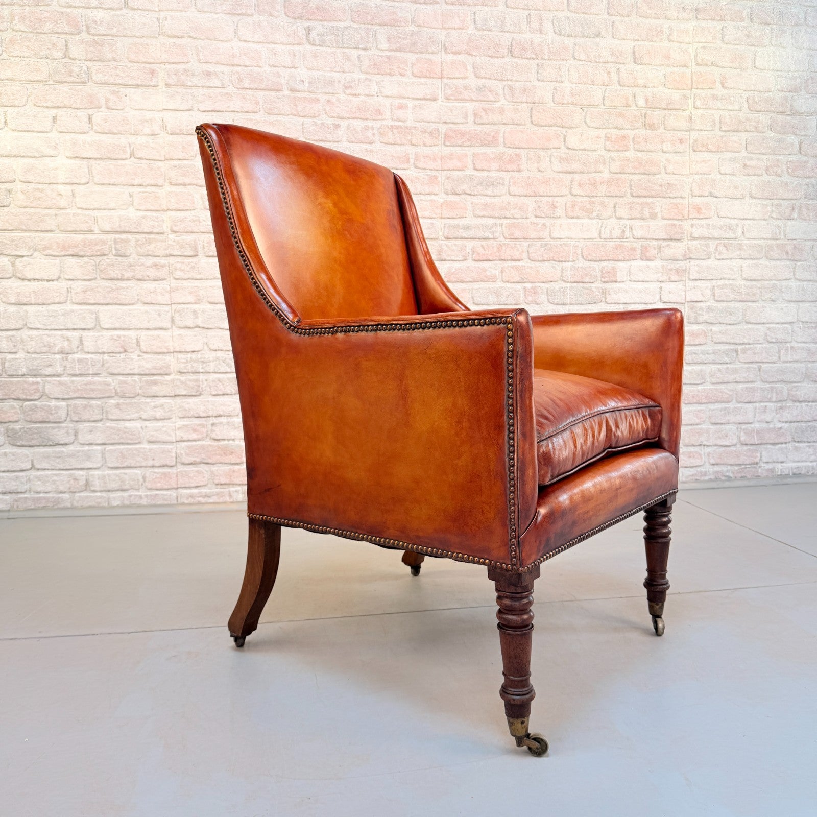 Circa 1910 Antique Tan Leather Armchair Hand Dyed Feather Cushions Castors