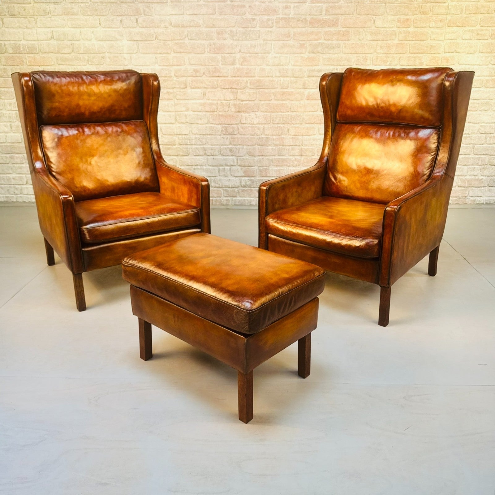 Pair Vintage Danish Wingback Chairs & Footstool Tan Leather Lounge Set