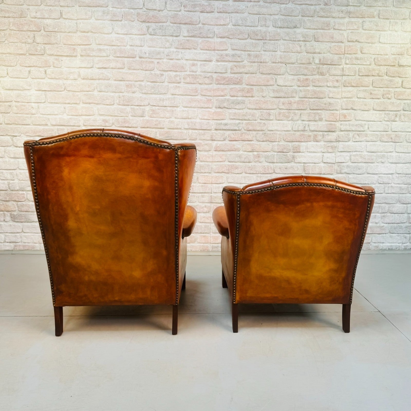 Vintage Pair of Danish Tan Leather Wingback Chairs