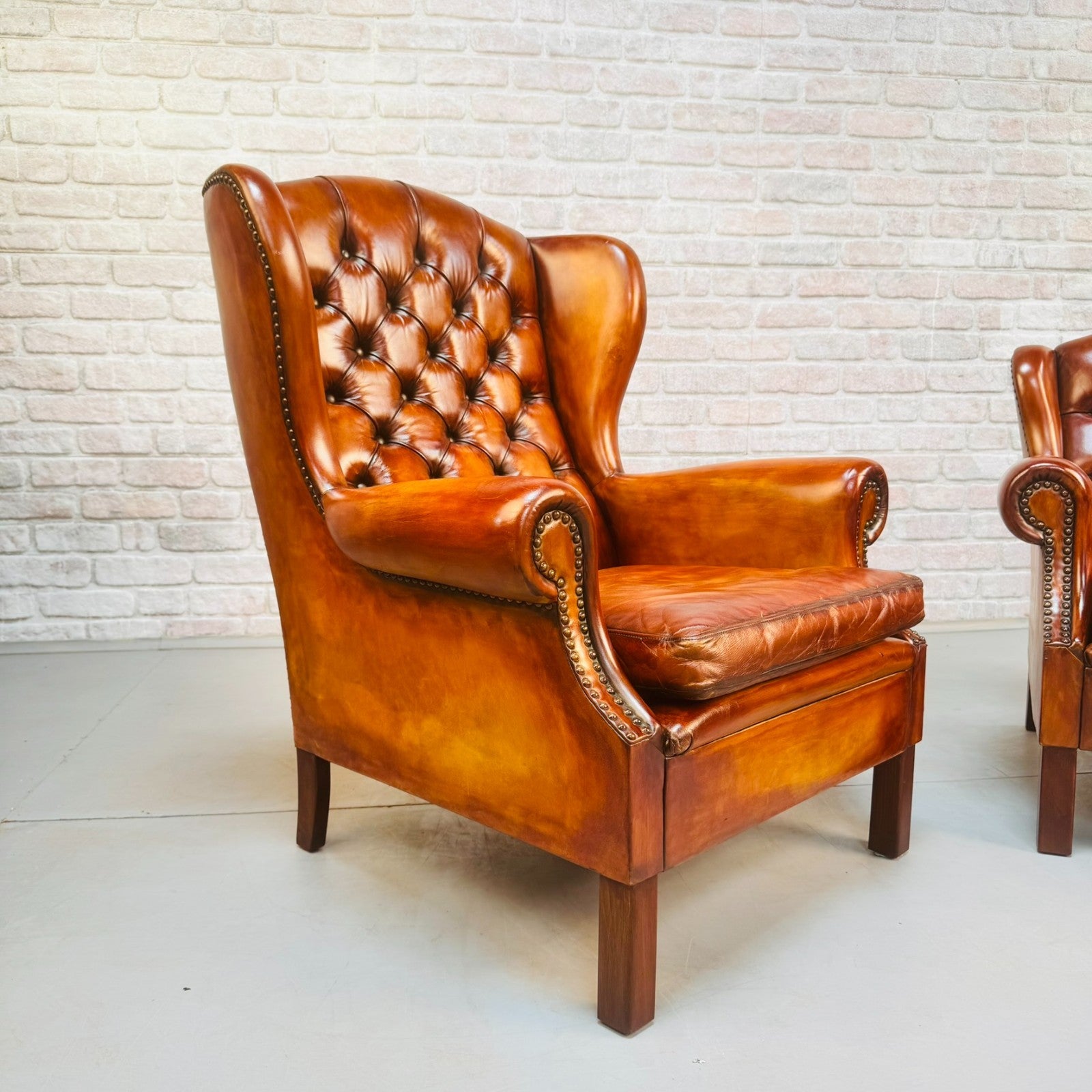 Vintage Pair of Danish Tan Leather Wingback Chairs