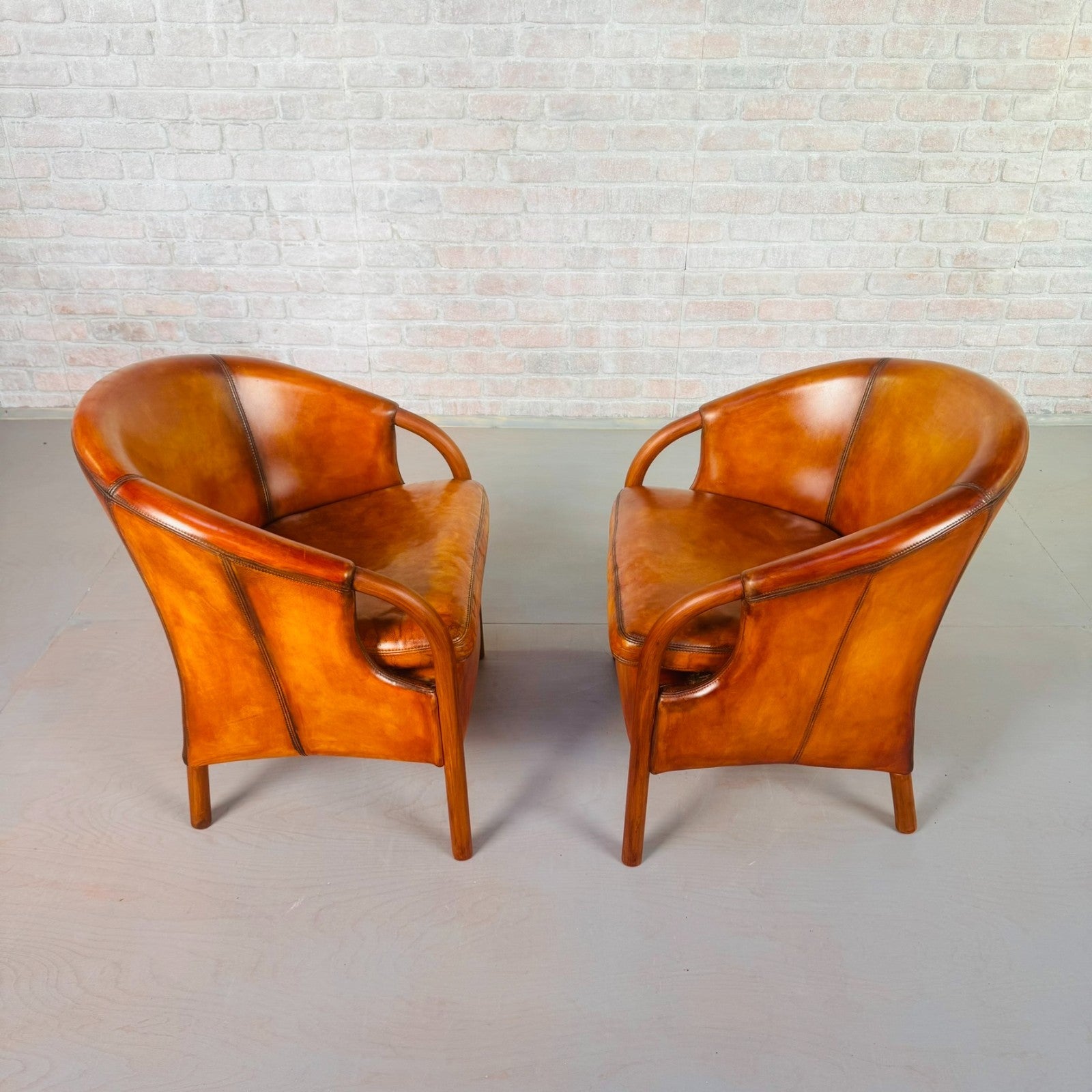 Pair of Vintage Danish Tan Leather Tub Chairs by Stouby