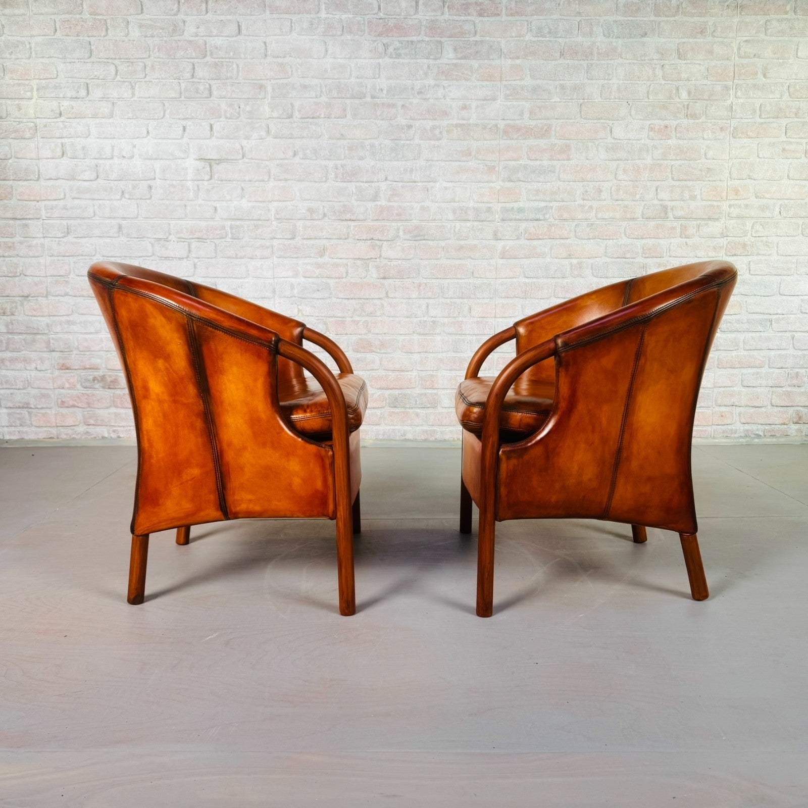 Pair of Vintage Danish Tan Leather Tub Chairs by Stouby