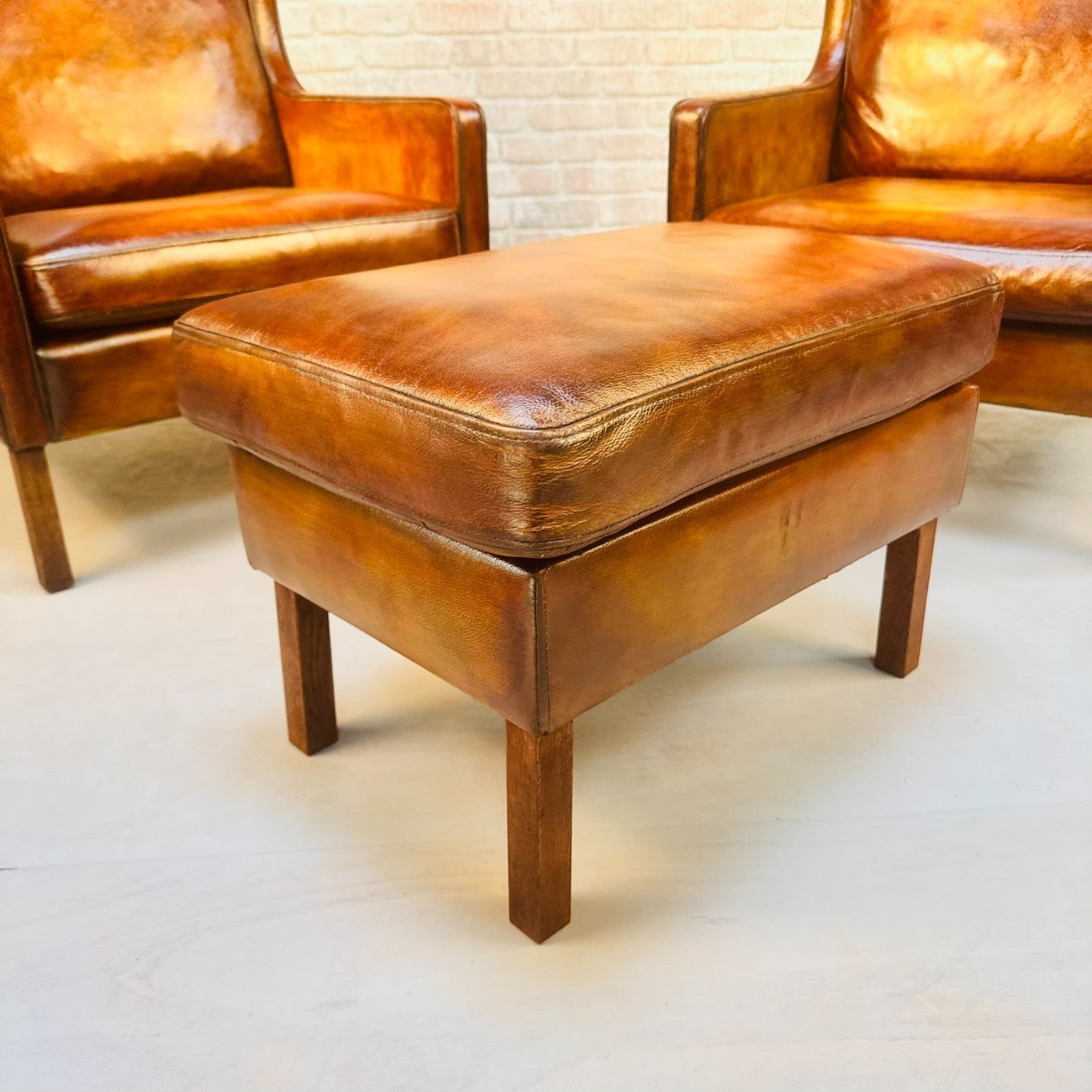 Pair Vintage Danish Wingback Chairs & Footstool Tan Leather Lounge Set
