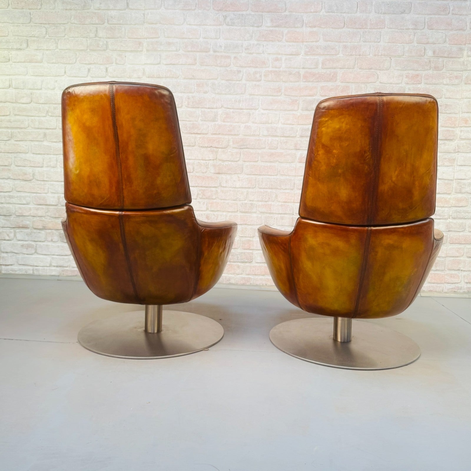 Pair of Vintage Italian Swivel Tan Leather Chairs