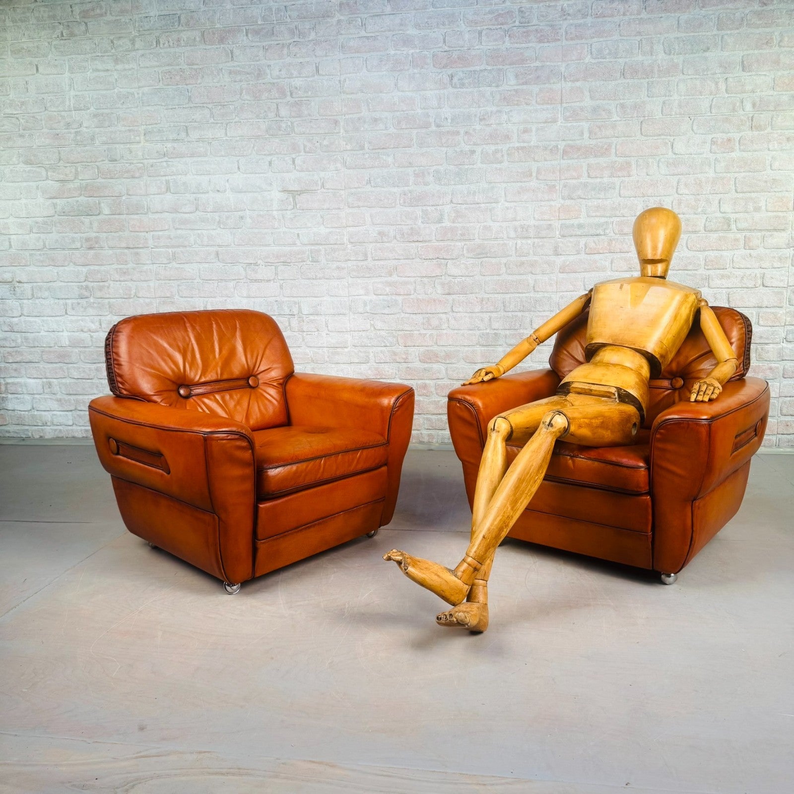 Pair of Elegant Danish Tan Leather Lounge Chairs
