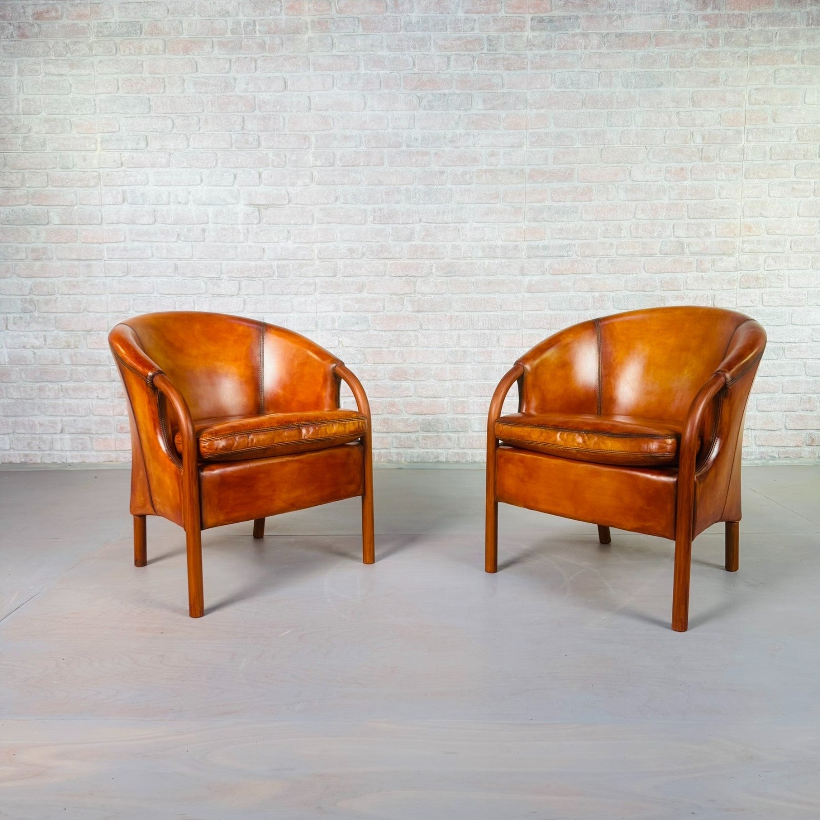 Pair of Vintage Danish Tan Leather Tub Chairs by Stouby