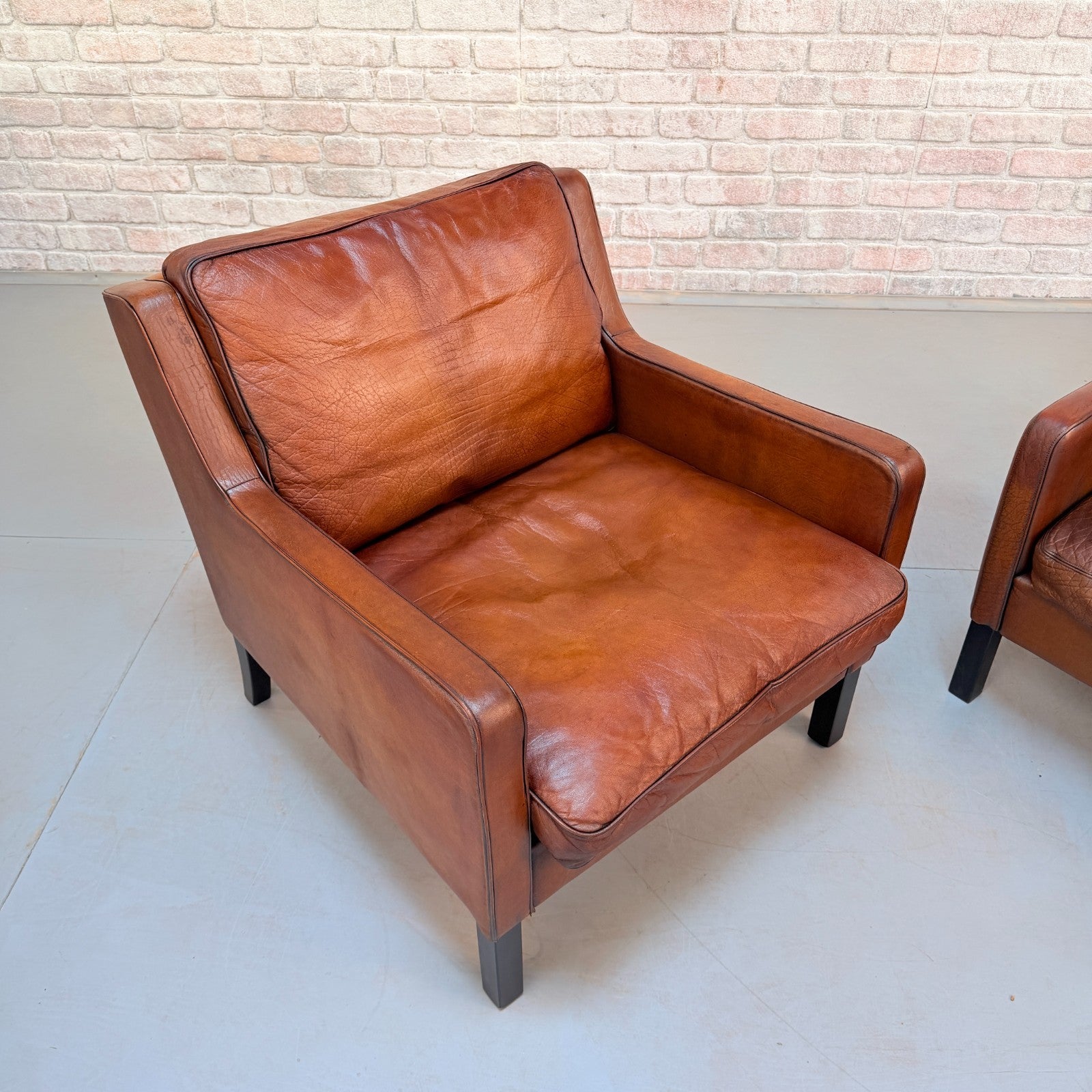 Vintage Near Pair Danish Tan Leather Armchairs Hand Dyed Feather Cushions