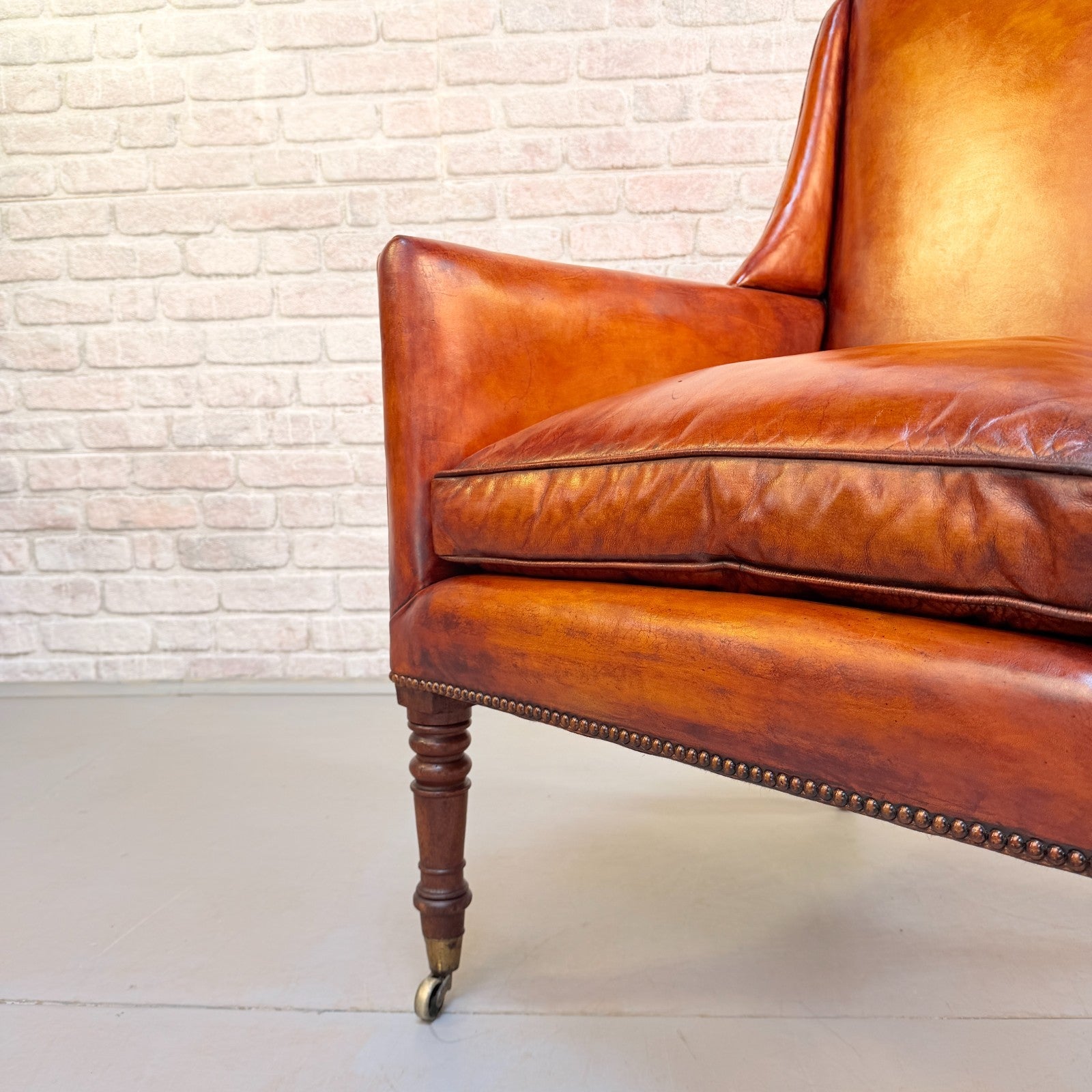 Circa 1910 Antique Tan Leather Armchair Hand Dyed Feather Cushions Castors