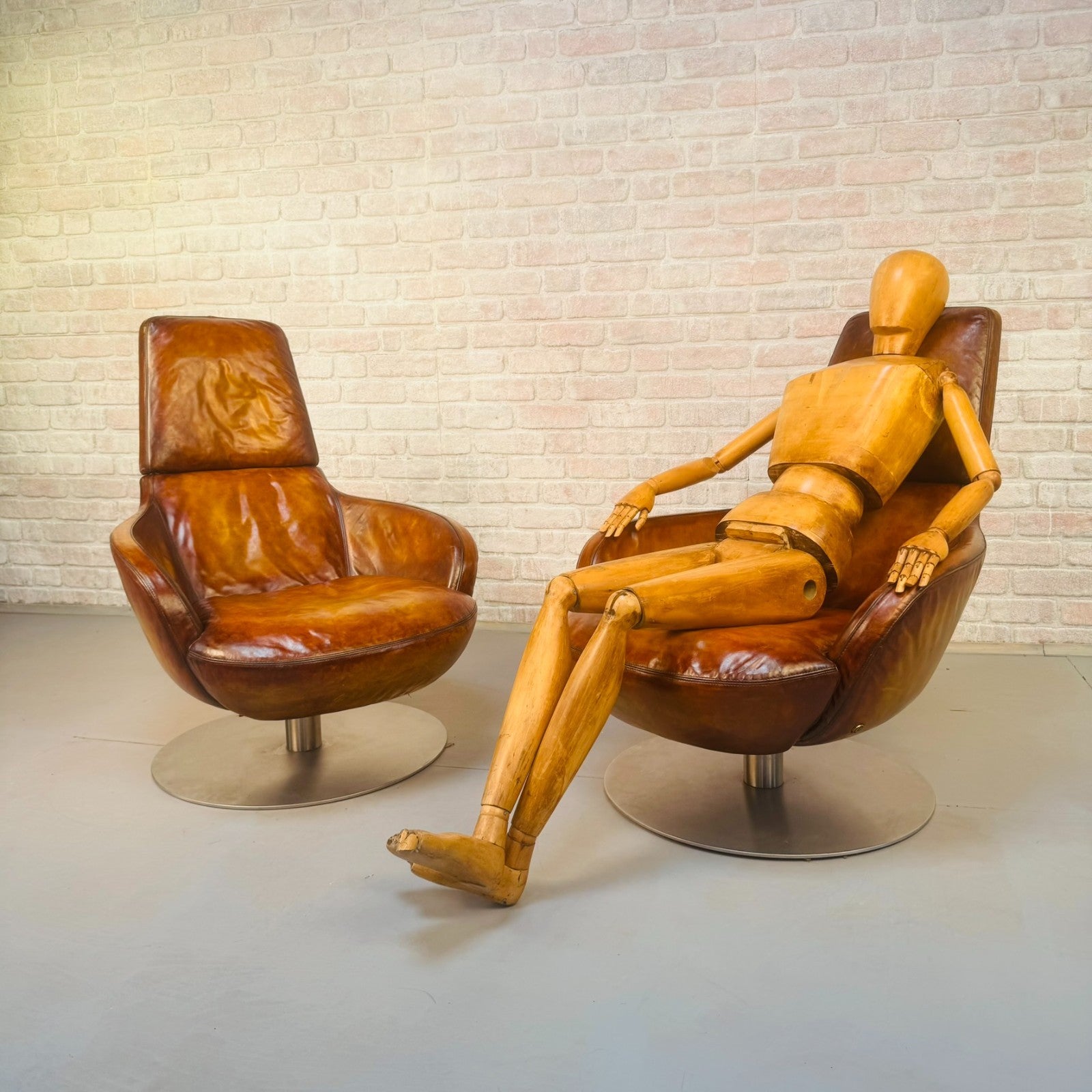 Pair of Vintage Italian Swivel Tan Leather Chairs