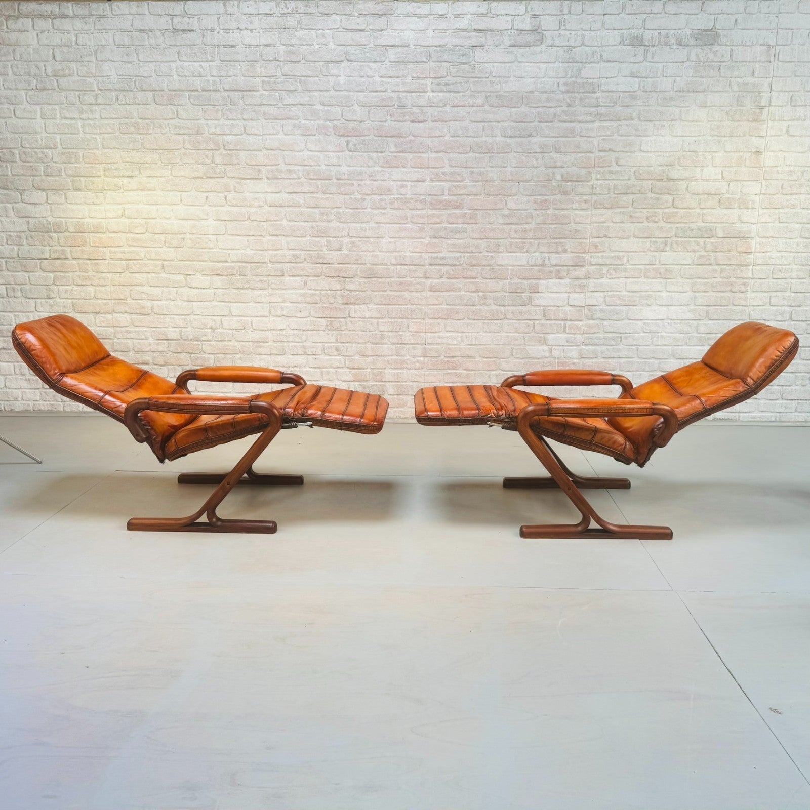 Pair of Vintage Danish Zero Gravity Reclining Tan Leather Armchairs Teak Frame