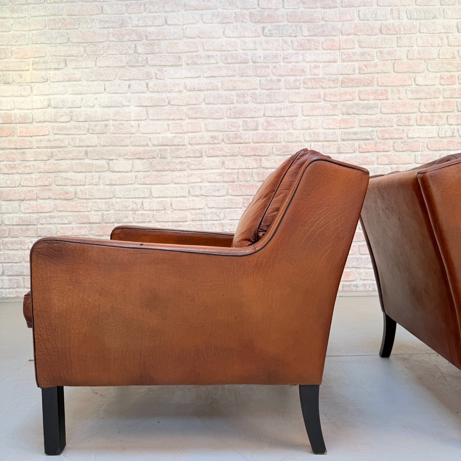 Vintage Near Pair Danish Tan Leather Armchairs Hand Dyed Feather Cushions