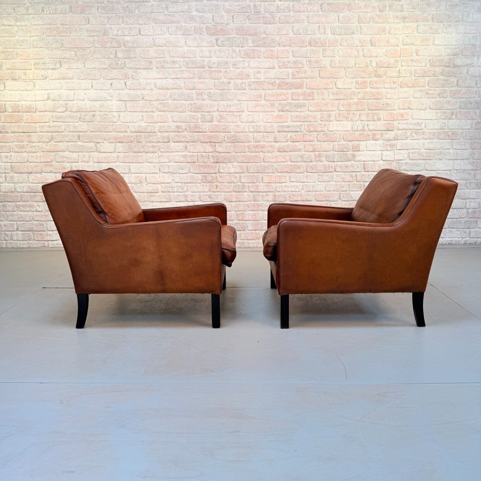 Vintage Near Pair Danish Tan Leather Armchairs Hand Dyed Feather Cushions