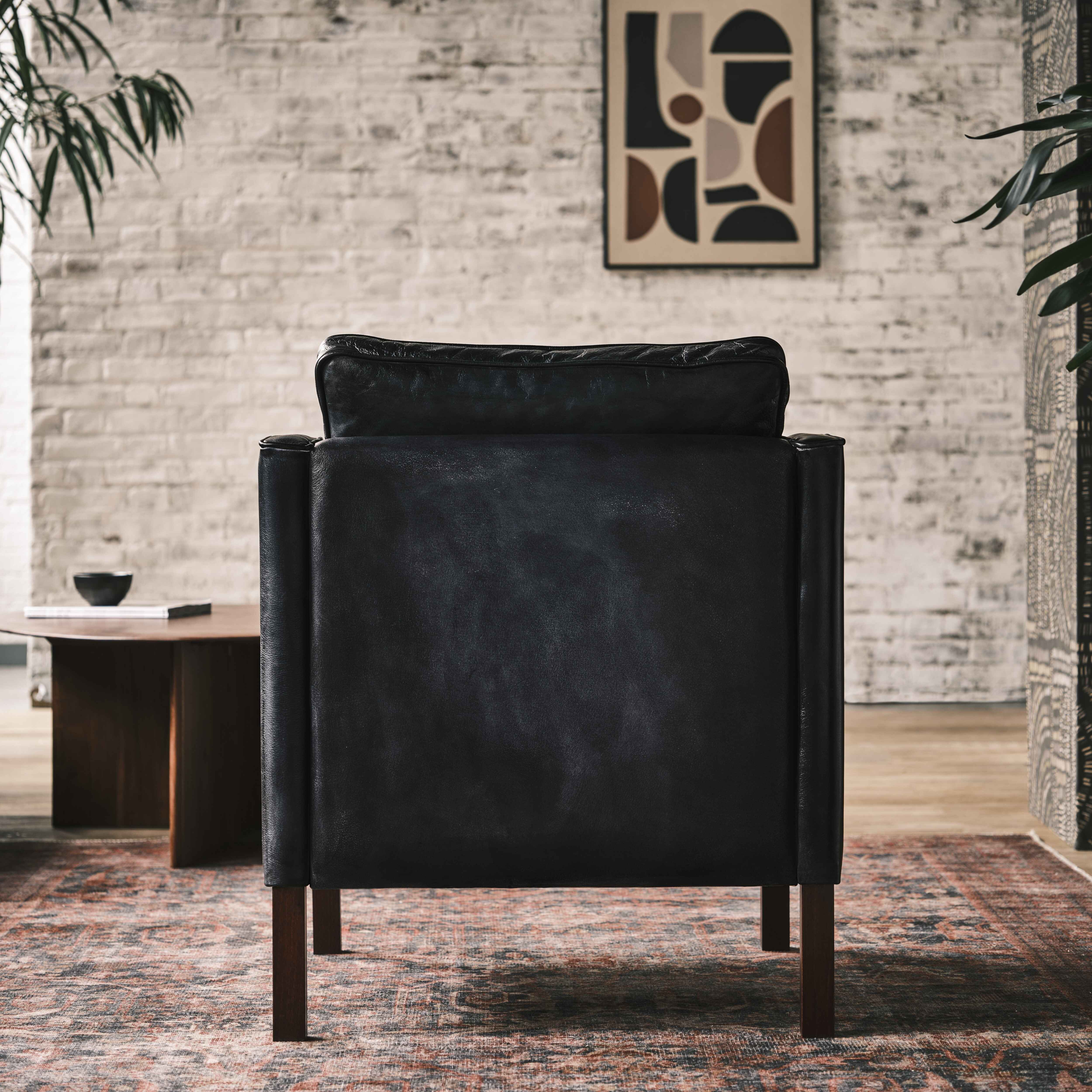 luxury-hand-dyed-mid-century-black-leather-armchair-loft-back