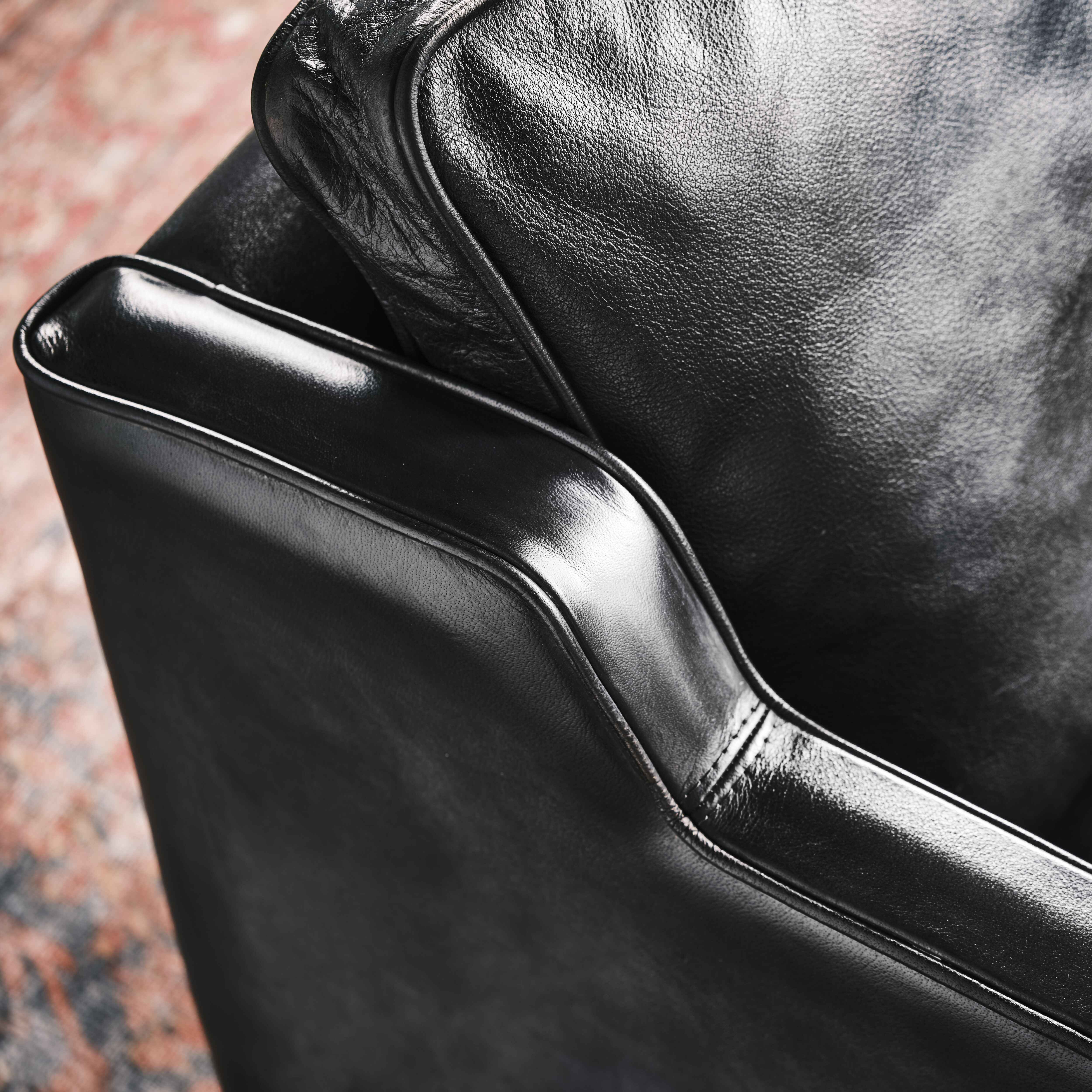luxury-hand-dyed-mid-century-black-leather-armchair-loft-close