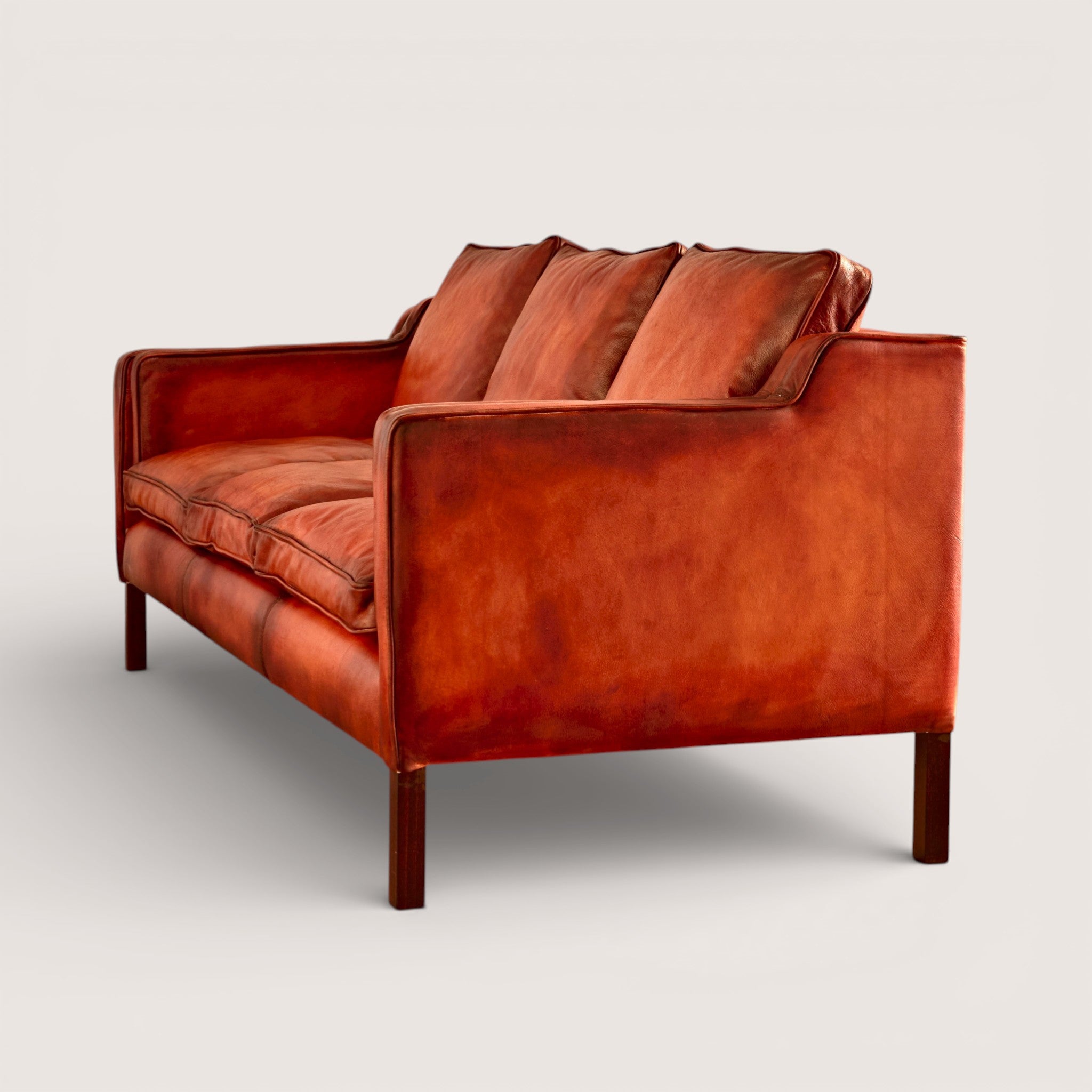 luxury-hand-dyed-mid-century-cognac-tan-leather-three-seater-sofa-white-background-back