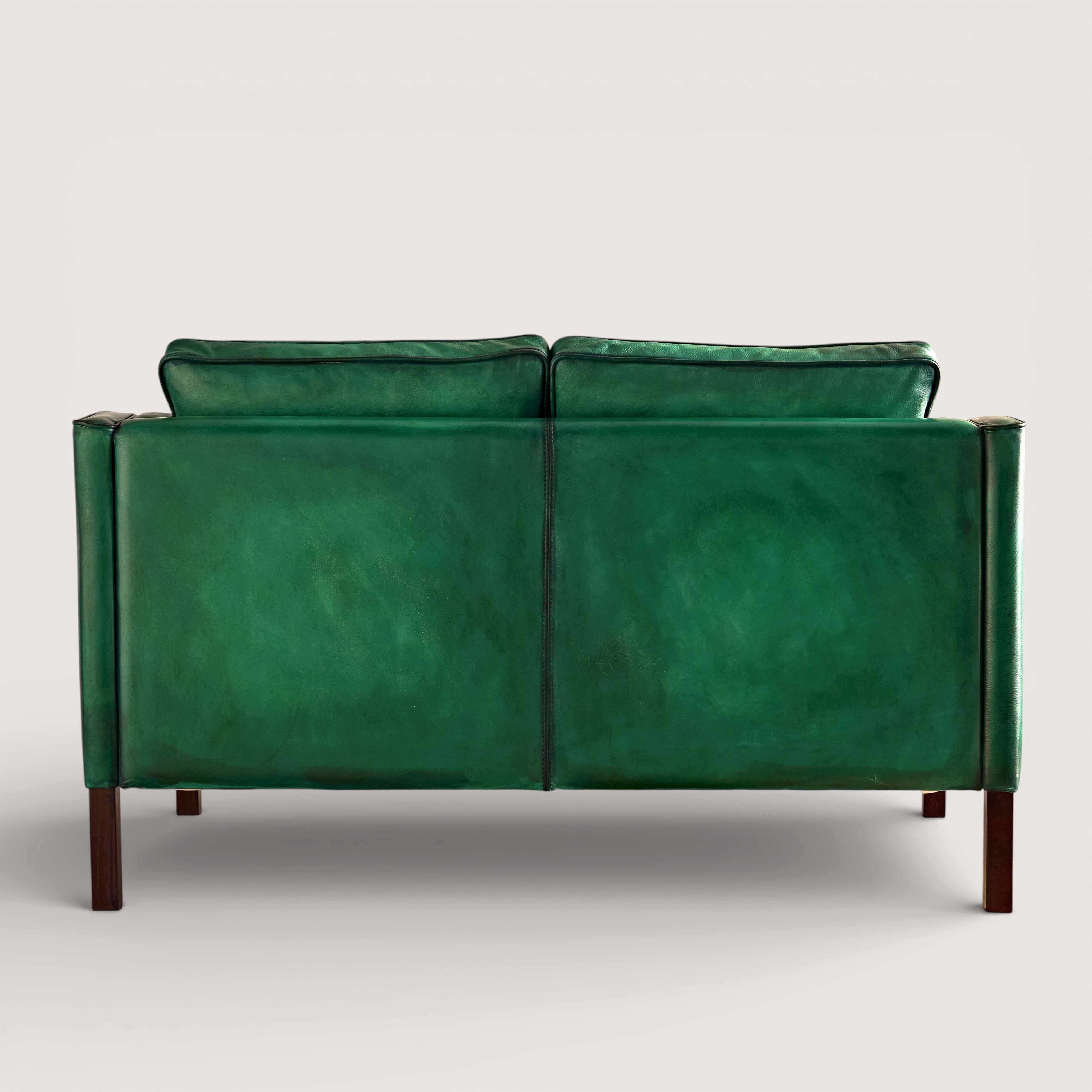 luxury-hand-dyed-mid-century-green-leather-two-seater-sofa-white-background-back