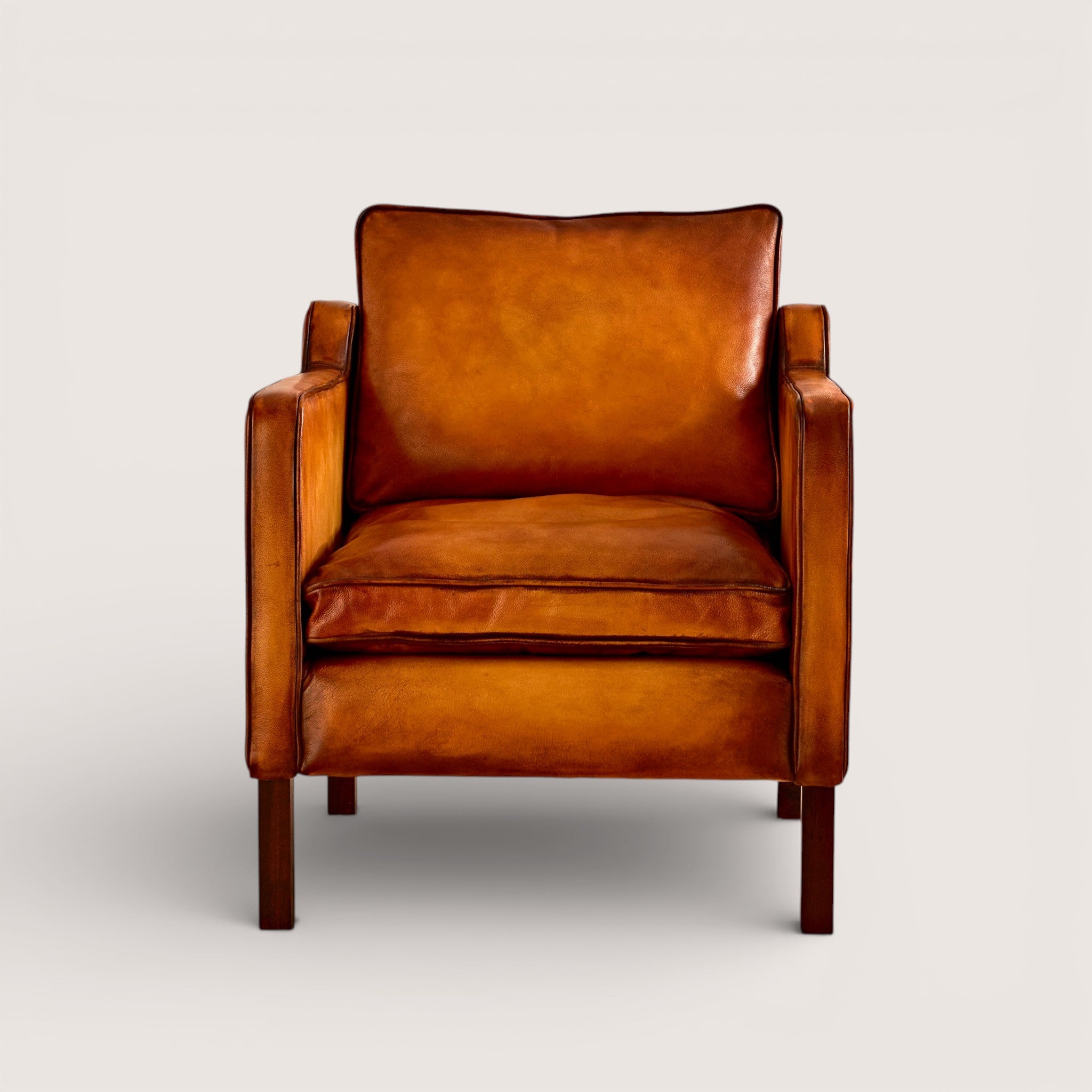 luxury-hand-dyed-mid-century-tan-leather-armchair-white-background-front