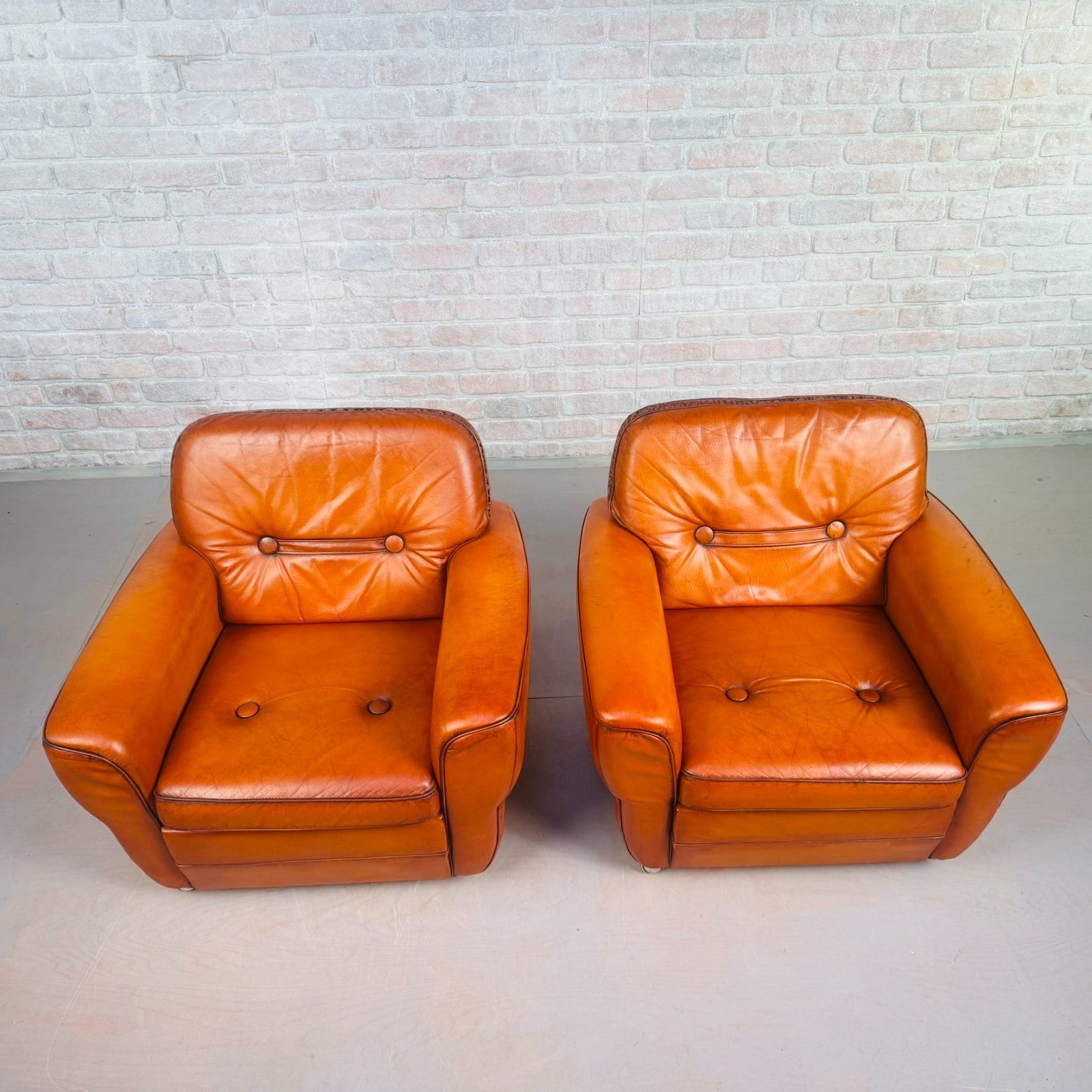 Pair of Elegant Danish Tan Leather Lounge Chairs