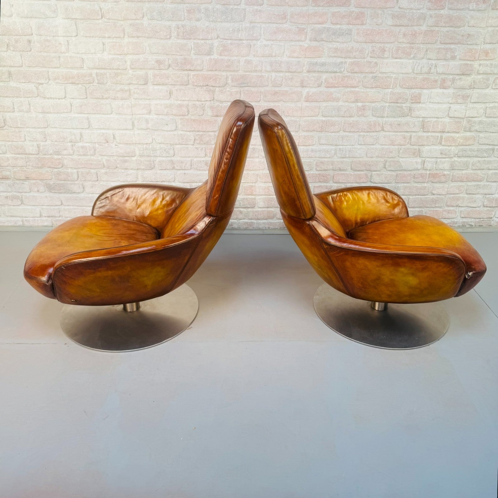 Pair of Vintage Italian Swivel Tan Leather Chairs