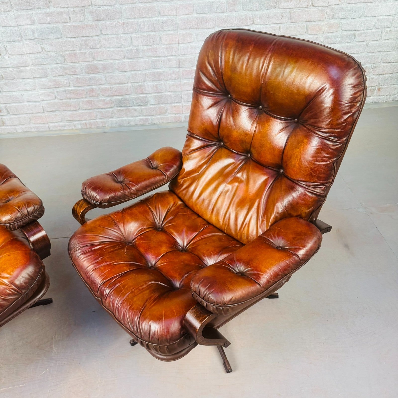 Pair of Vintage Danish Tan Leather Swivel Chairs  Stylish