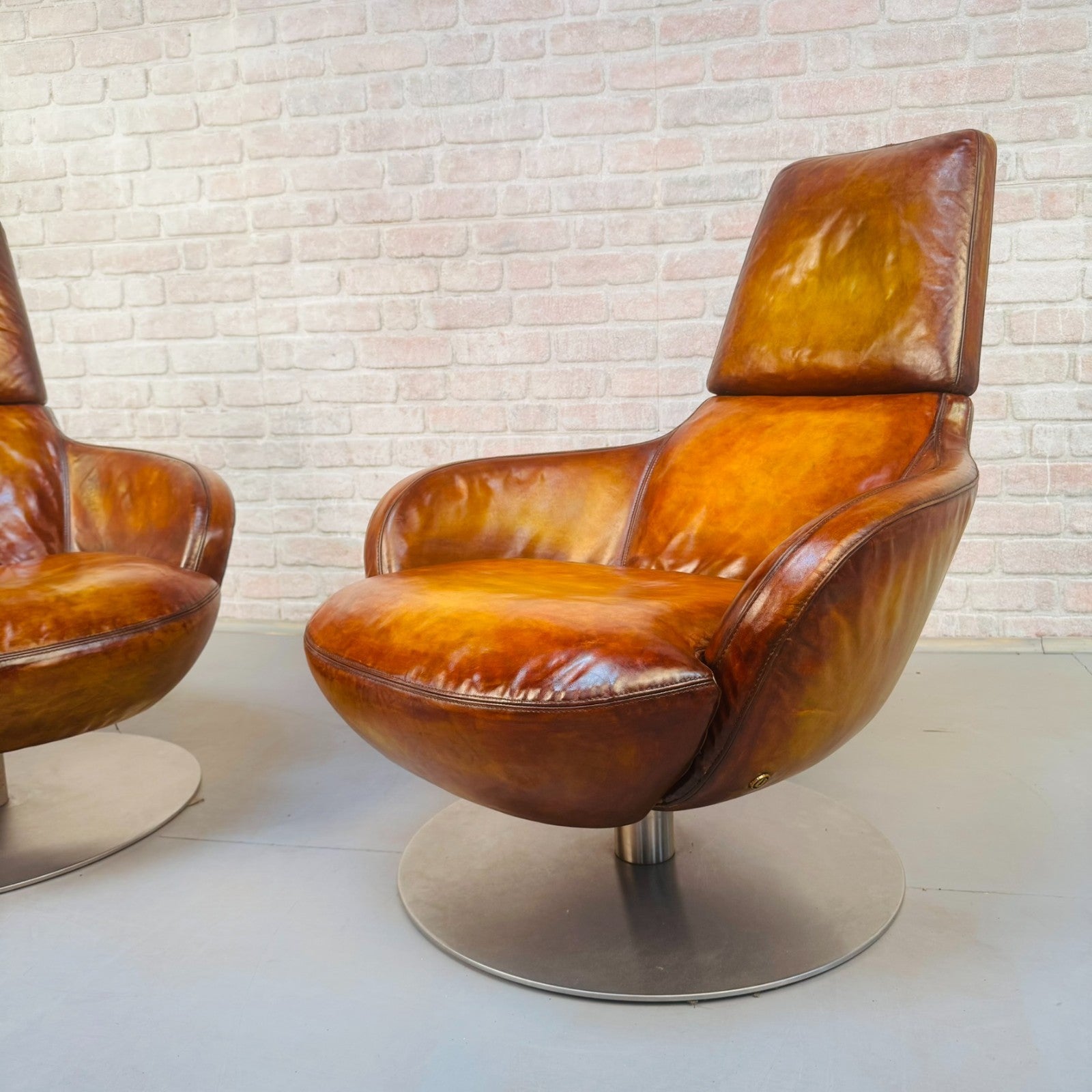 Pair of Vintage Italian Swivel Tan Leather Chairs
