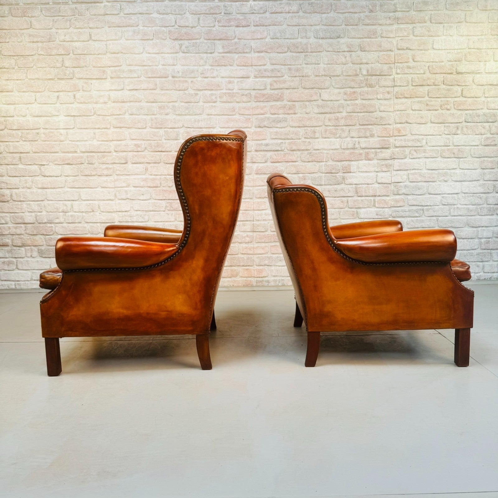 Vintage Pair of Danish Tan Leather Wingback Chairs