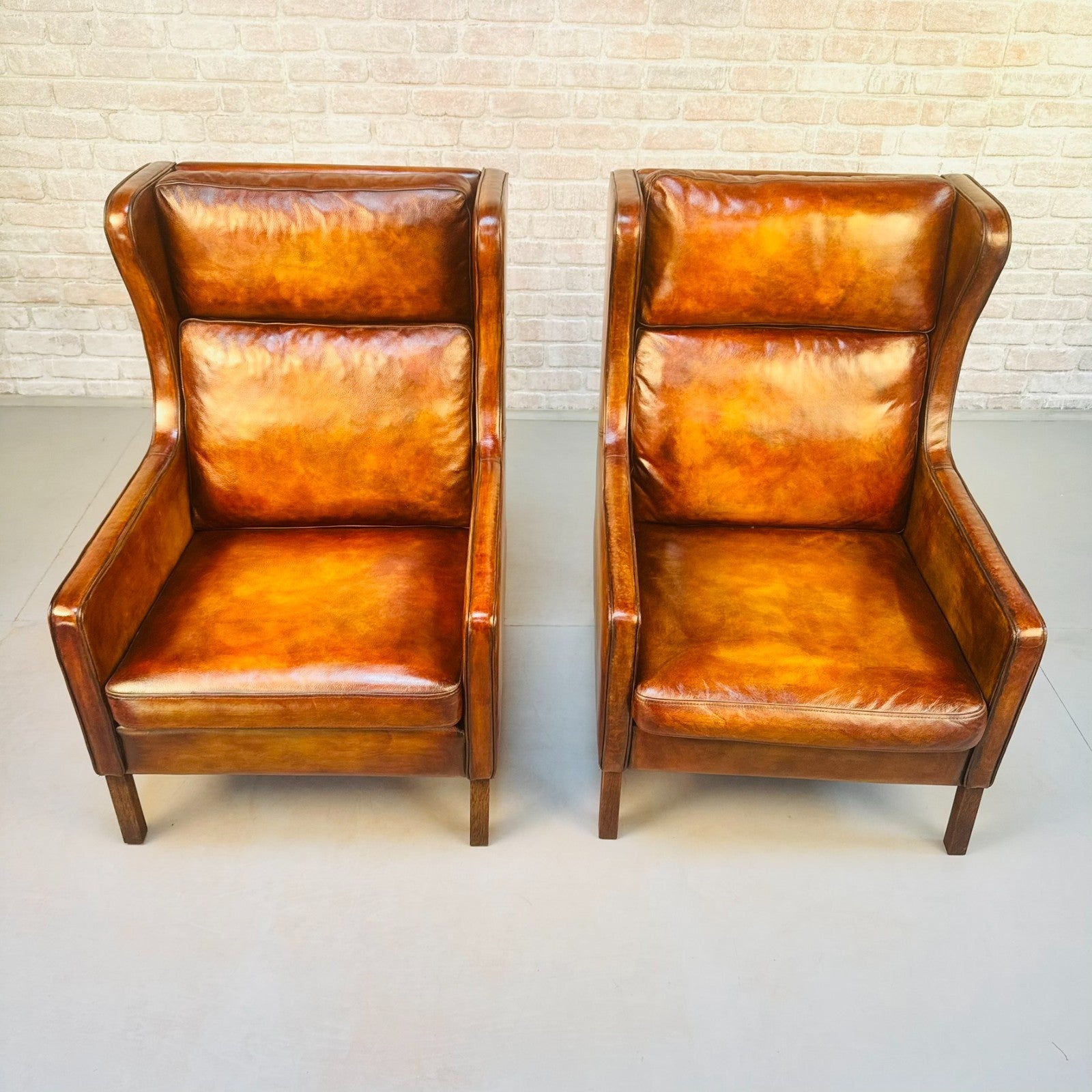 Pair Vintage Danish Wingback Chairs & Footstool Tan Leather Lounge Set