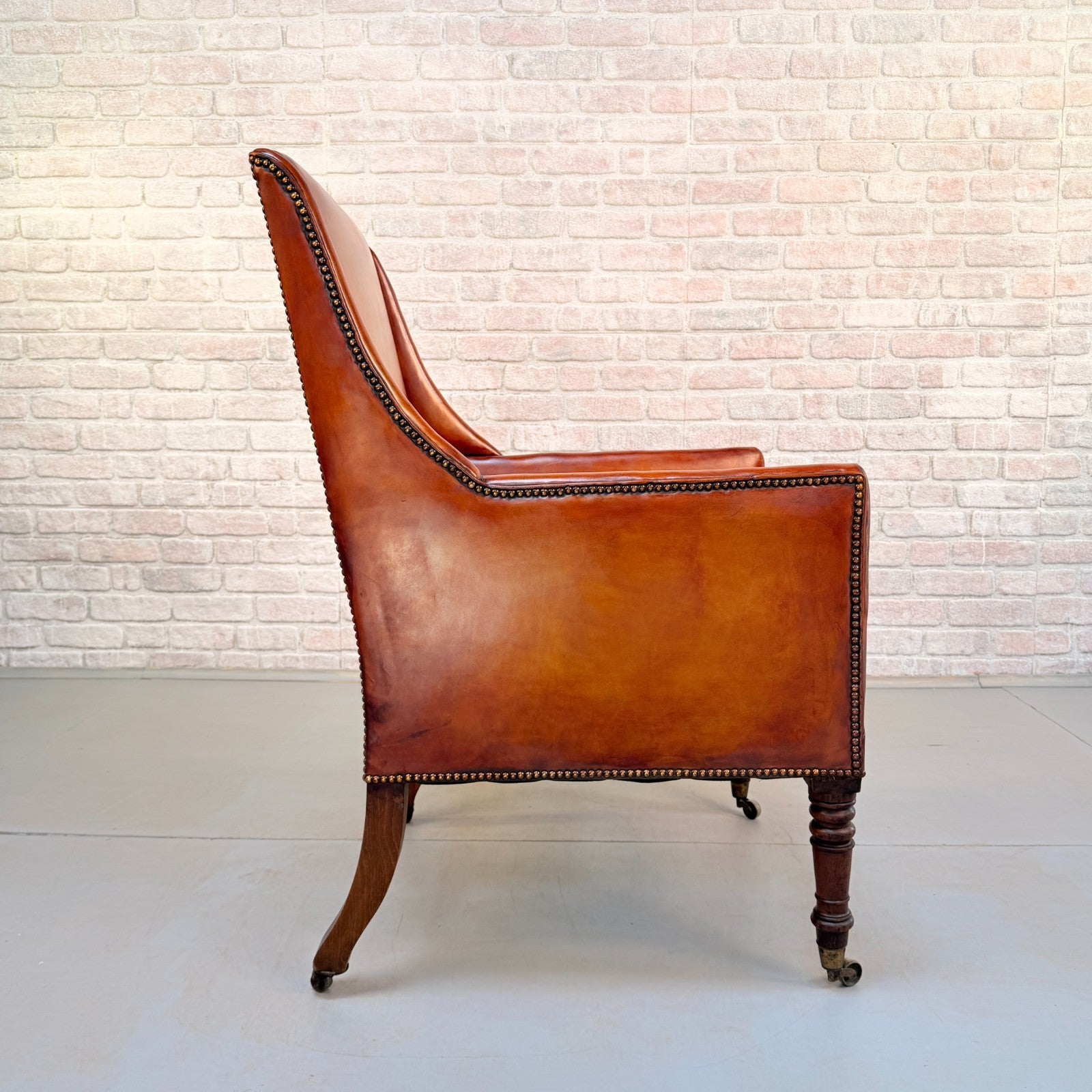 Circa 1910 Antique Tan Leather Armchair Hand Dyed Feather Cushions Castors