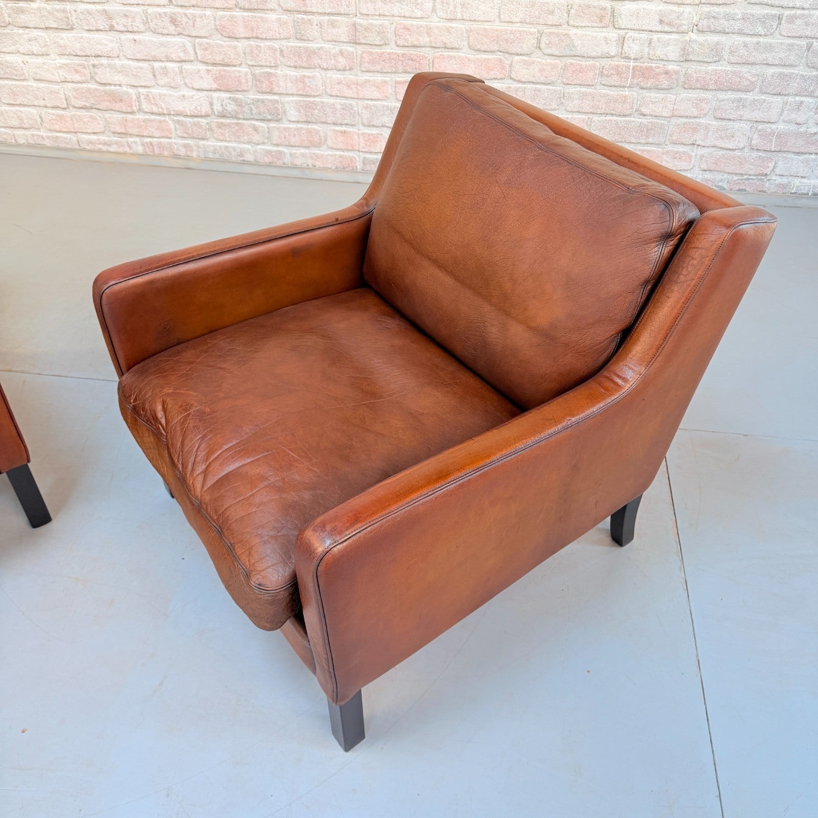 Vintage Near Pair Danish Tan Leather Armchairs Hand Dyed Feather Cushions