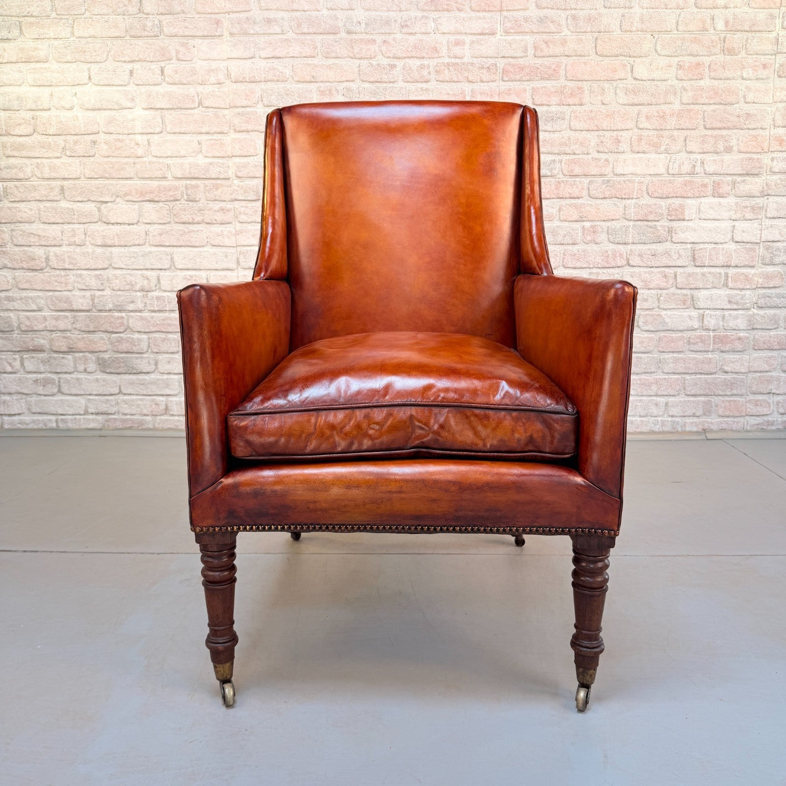Circa 1910 Antique Tan Leather Armchair Hand Dyed Feather Cushions Castors