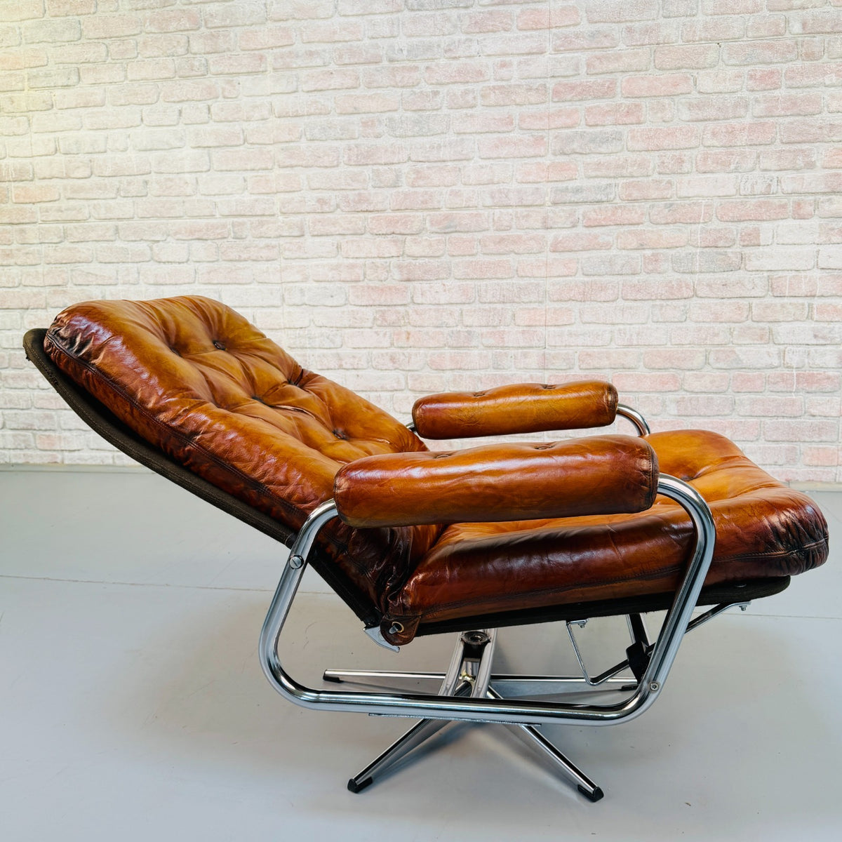 1970s Vintage Danish Tan Leather Swivel Recliner Armchair Chrome Frame