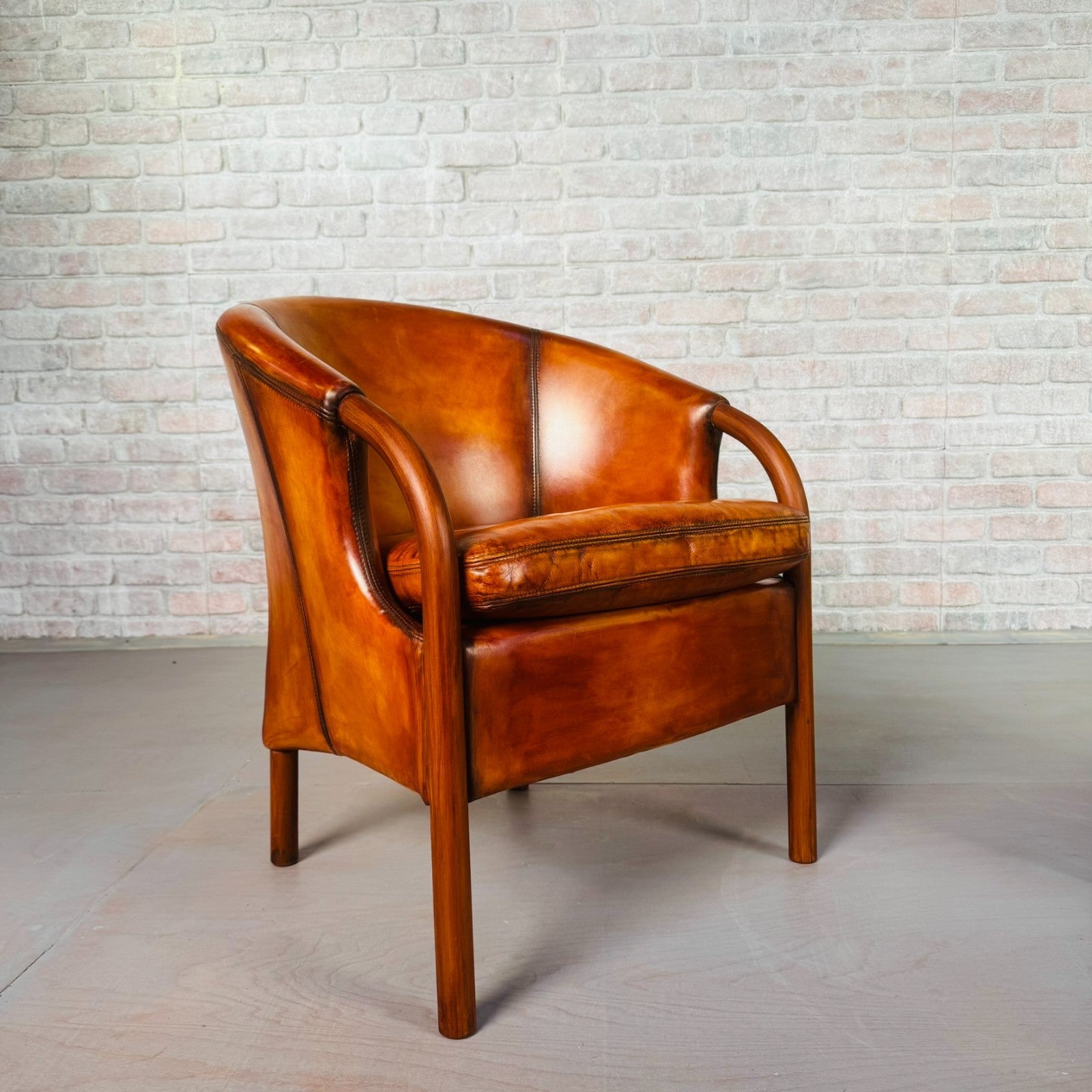 Pair of Vintage Danish Tan Leather Tub Chairs by Stouby