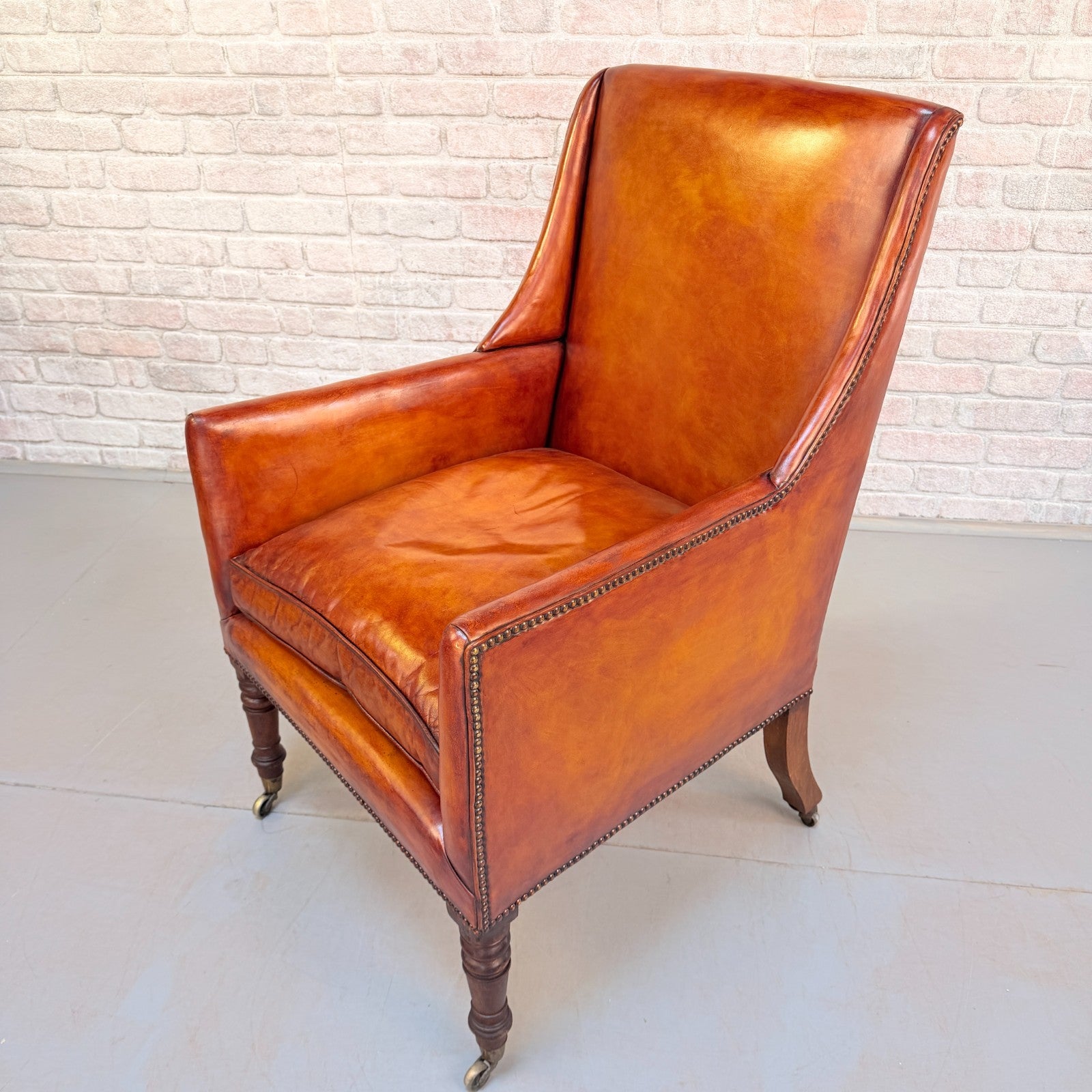 Circa 1910 Antique Tan Leather Armchair Hand Dyed Feather Cushions Castors