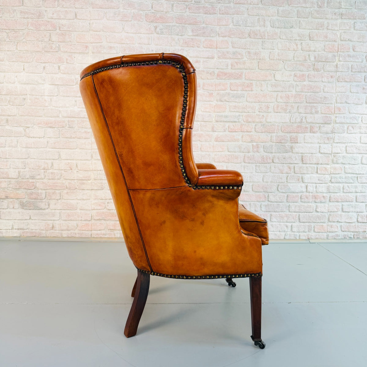 Vintage English Barrel Back Hand Dyed Tan Leather Wingback Armchair