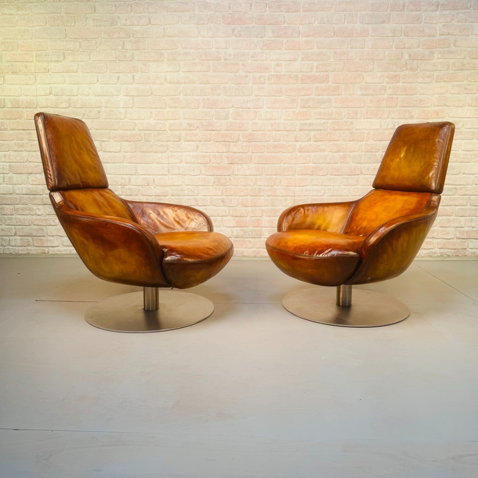 Pair of Vintage Italian Swivel Tan Leather Chairs