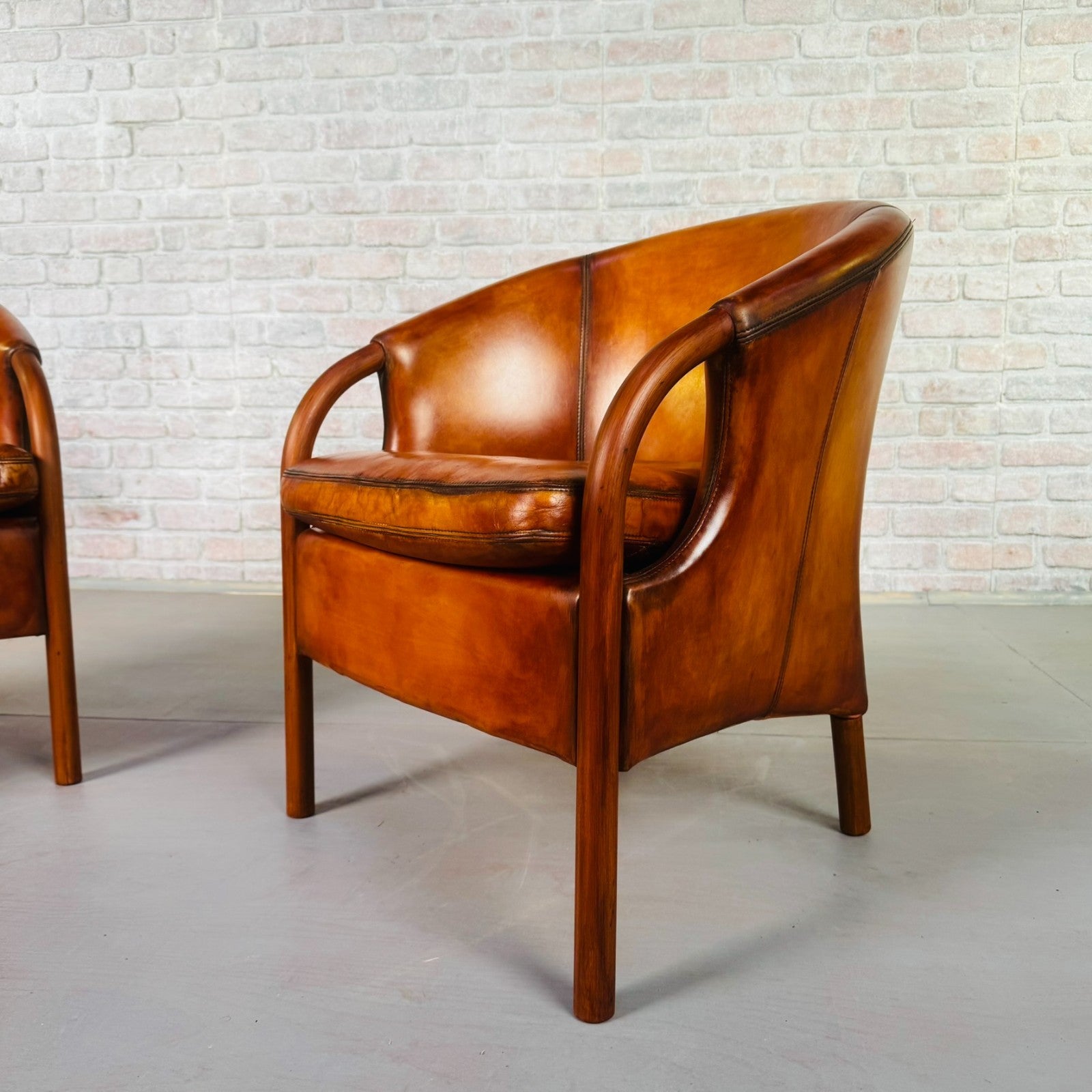 Pair of Vintage Danish Tan Leather Tub Chairs by Stouby